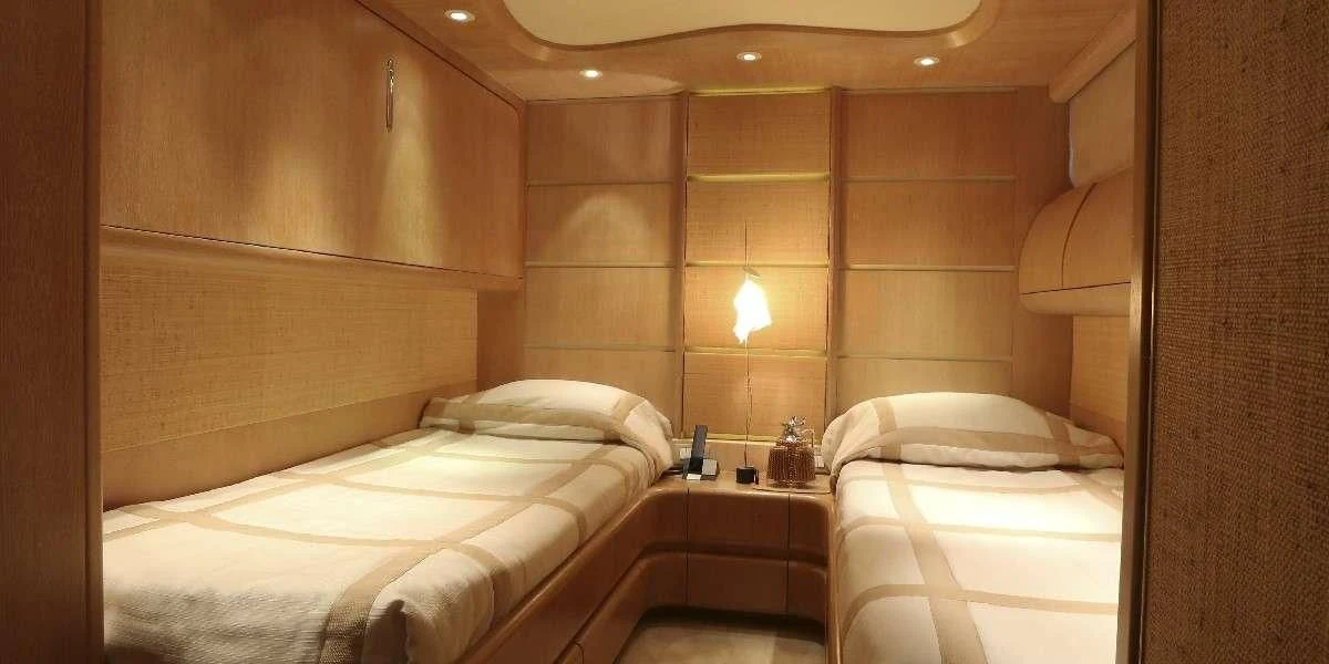 a room with two beds aboard IF Yacht for Sale