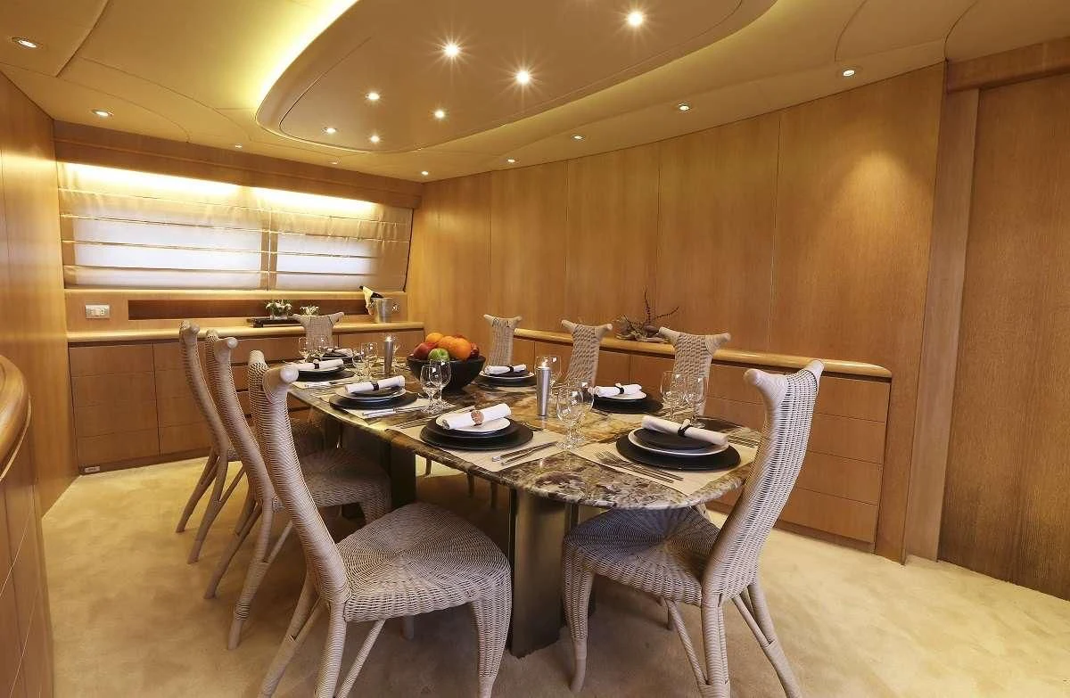 a table set for a dinner aboard IF Yacht for Sale