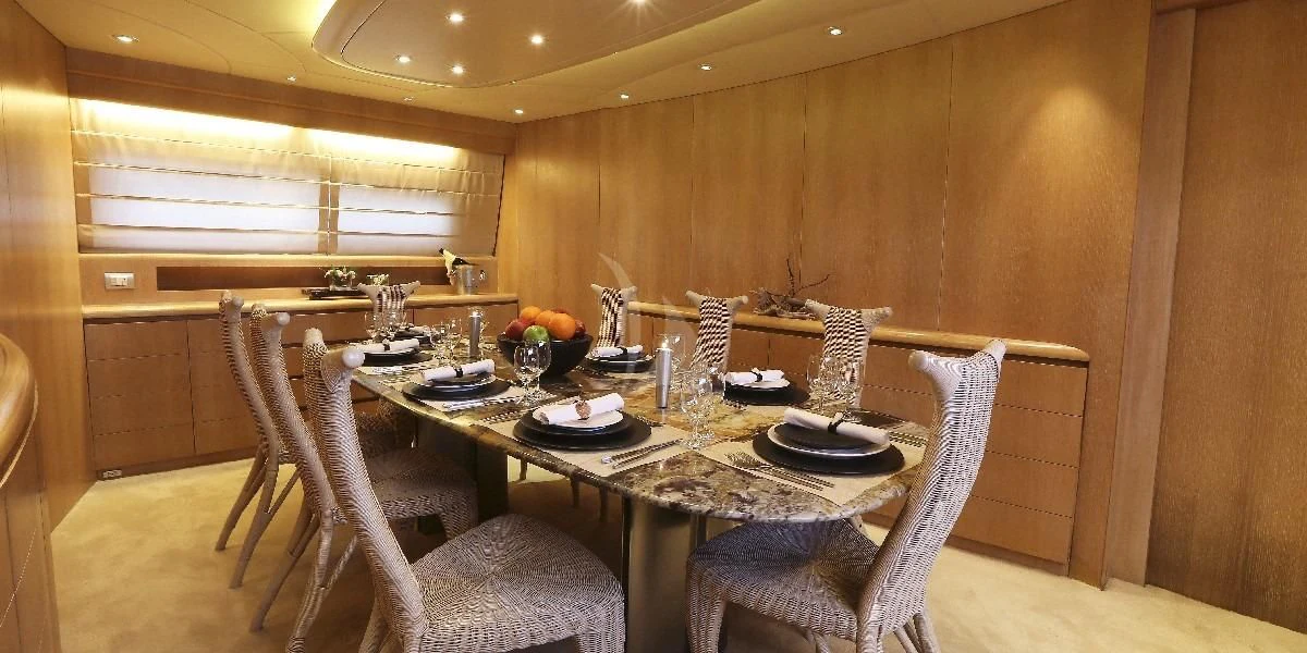 a dining table set for a meal aboard IF Yacht for Sale