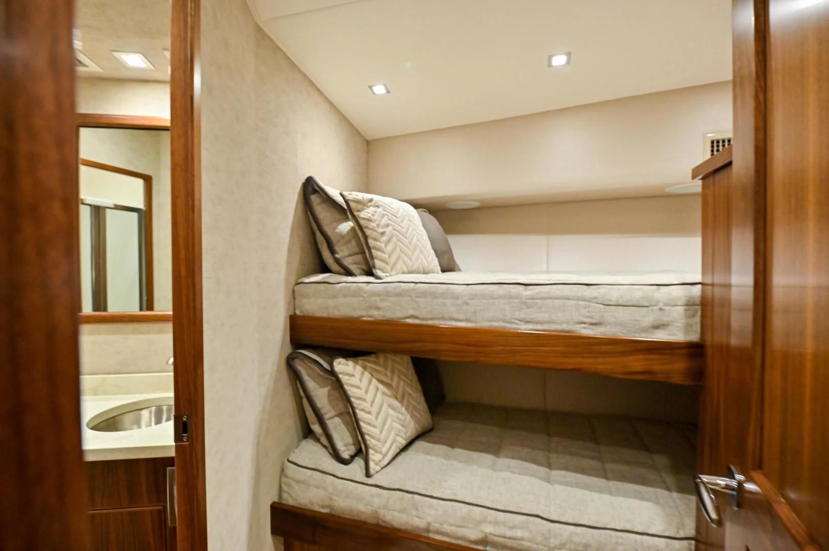 a bed with a chair aboard EL LOBO Yacht for Sale