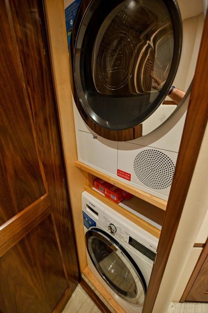a washer and dryer in a closet aboard EL LOBO Yacht for Sale