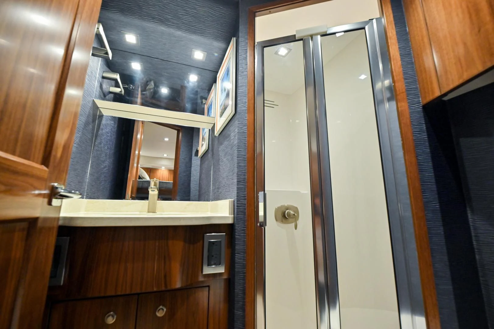 a room with a door and cabinets aboard EL LOBO Yacht for Sale