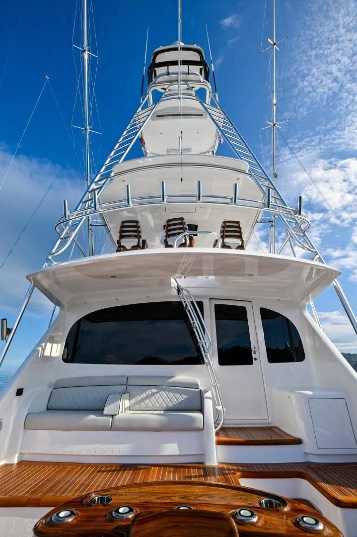 a white yacht on a dock aboard EL LOBO Yacht for Sale