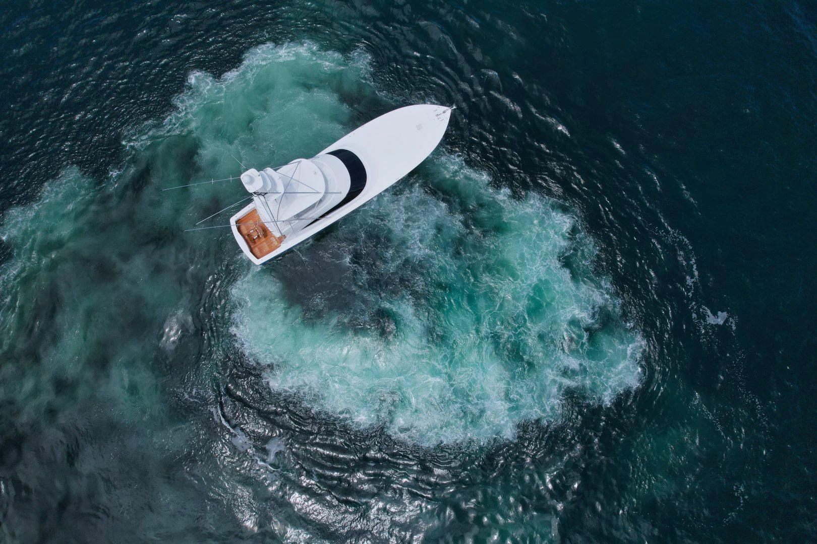 a person surfing on the waves aboard EL LOBO Yacht for Sale