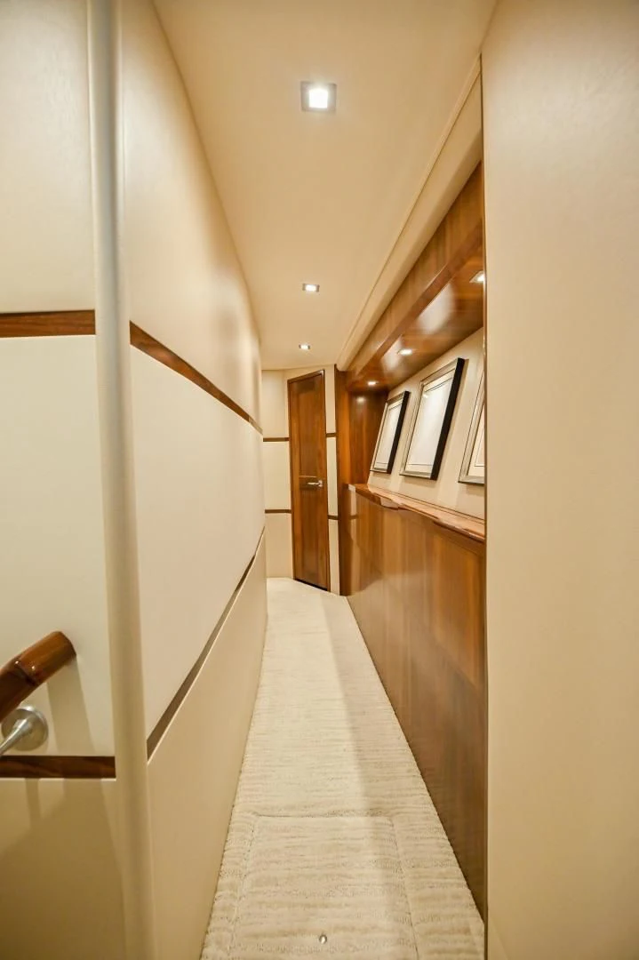 a hallway with a door and a window aboard EL LOBO Yacht for Sale