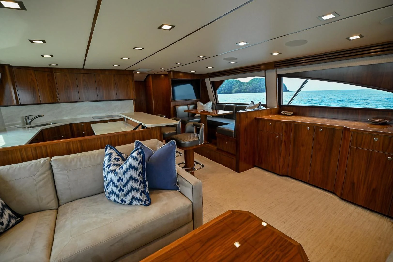 a living room with a couch and a table aboard EL LOBO Yacht for Sale