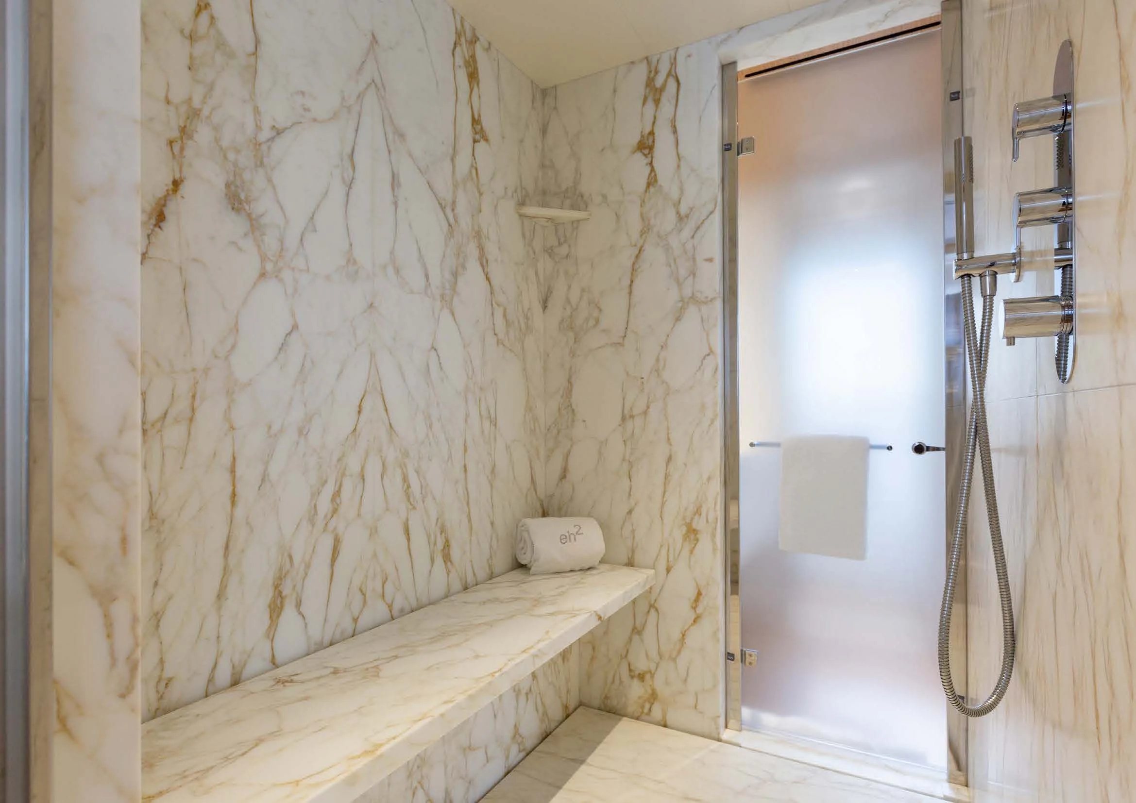 a bathroom with a shower curtain aboard EH2 Yacht for Sale
