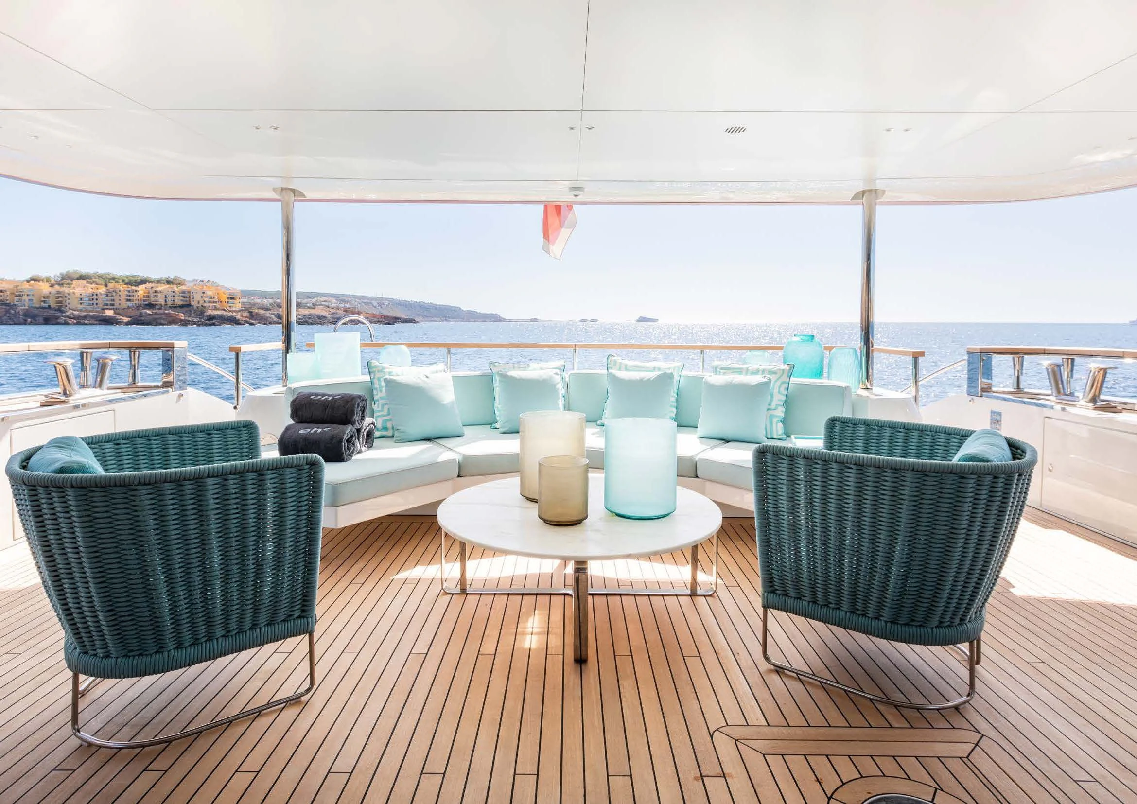 a patio with chairs and tables aboard EH2 Yacht for Sale