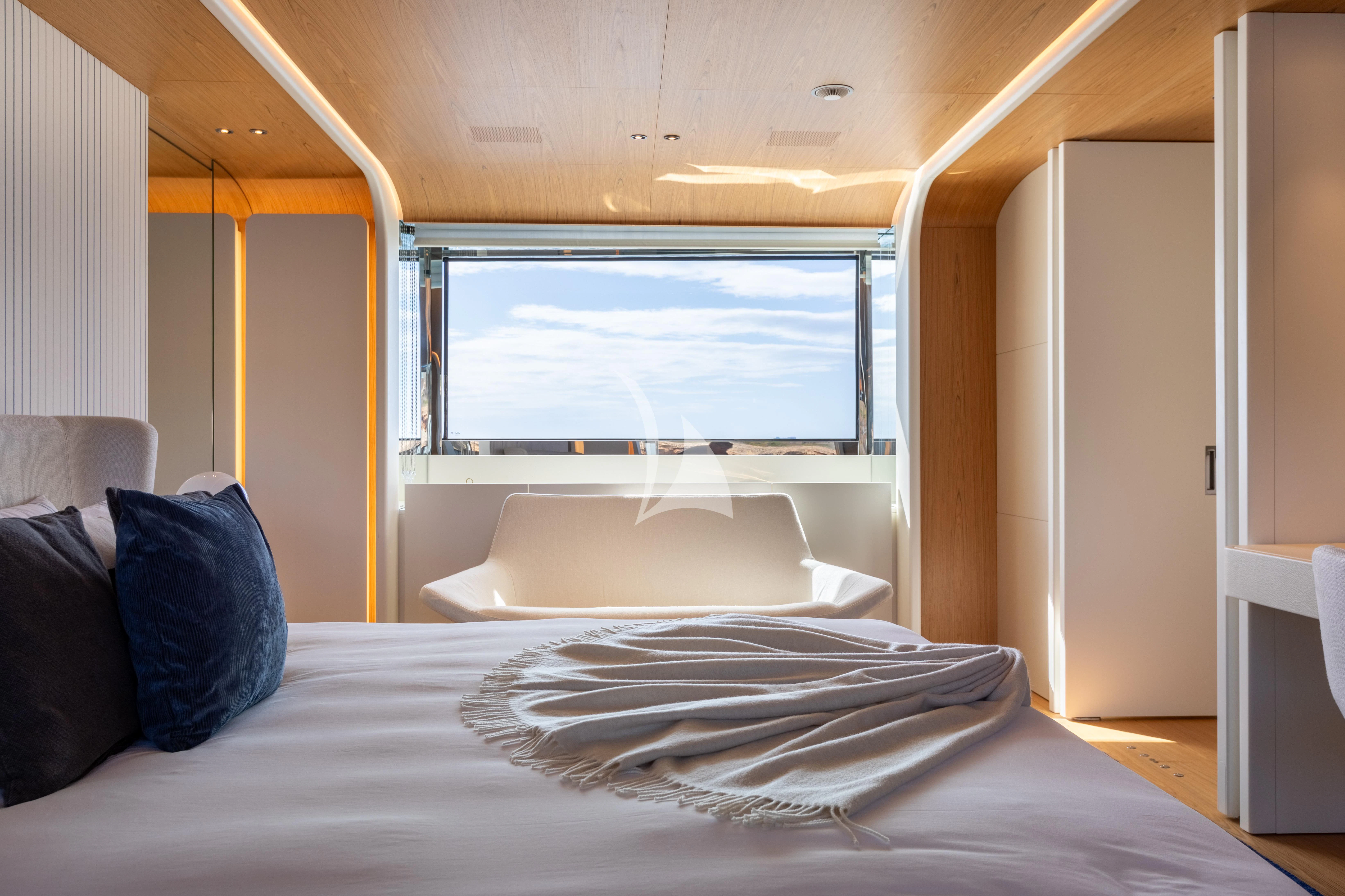 a bed with a white sheet and pillows aboard EH2 Yacht for Sale