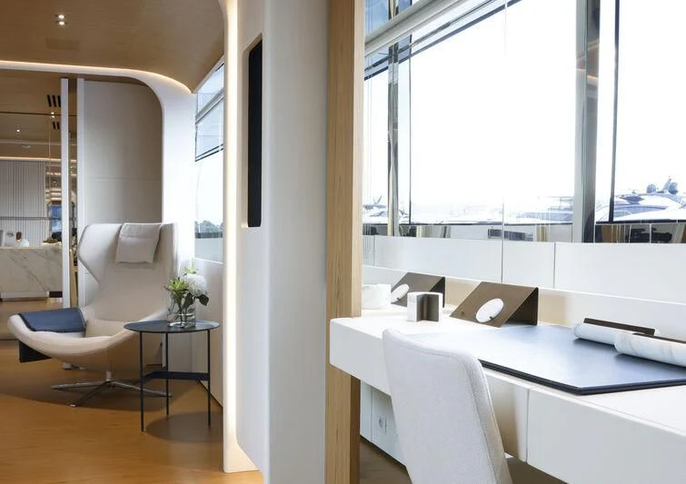 a room with a table and chairs aboard EH2 Yacht for Sale