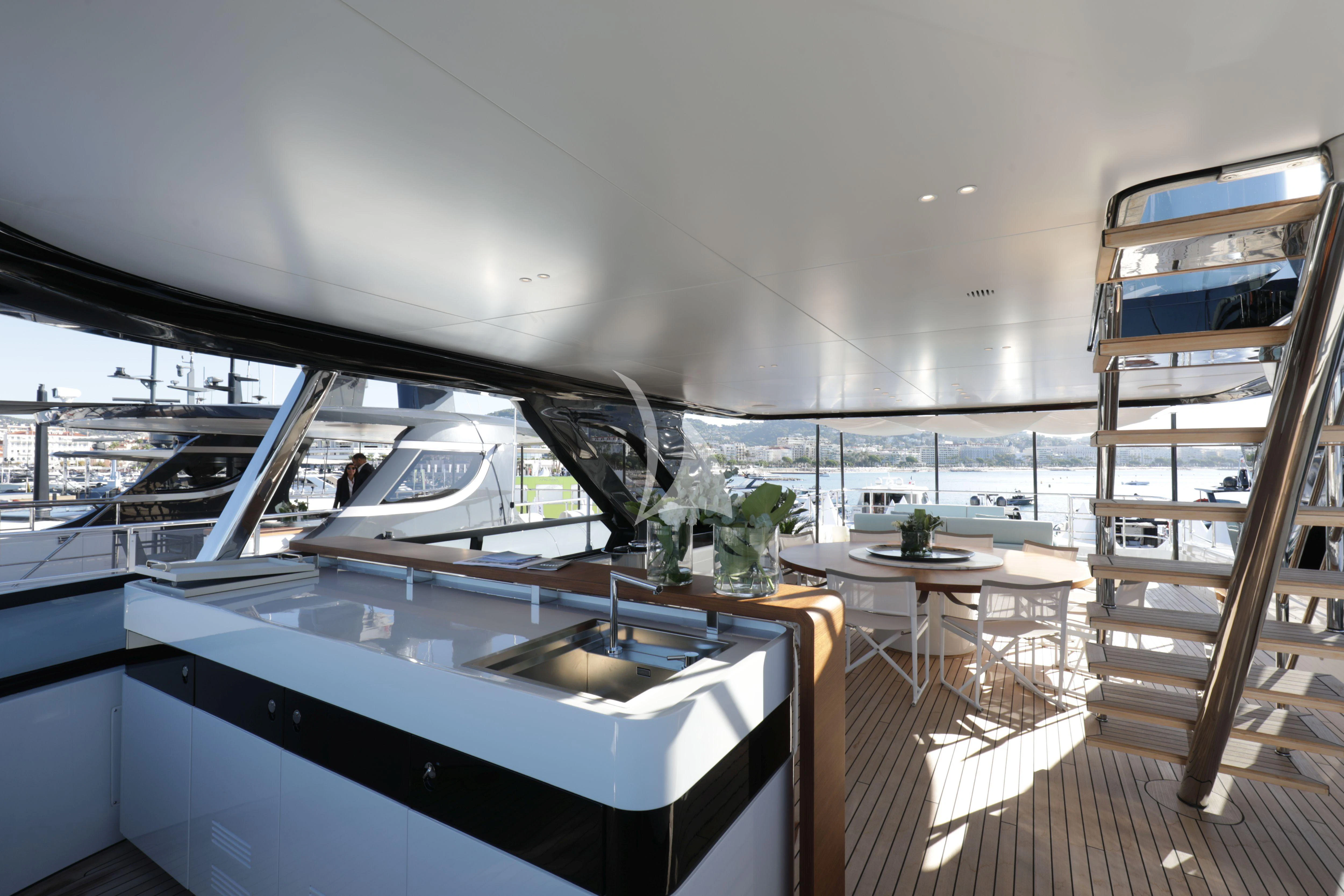 a room with a table and chairs aboard EH2 Yacht for Sale