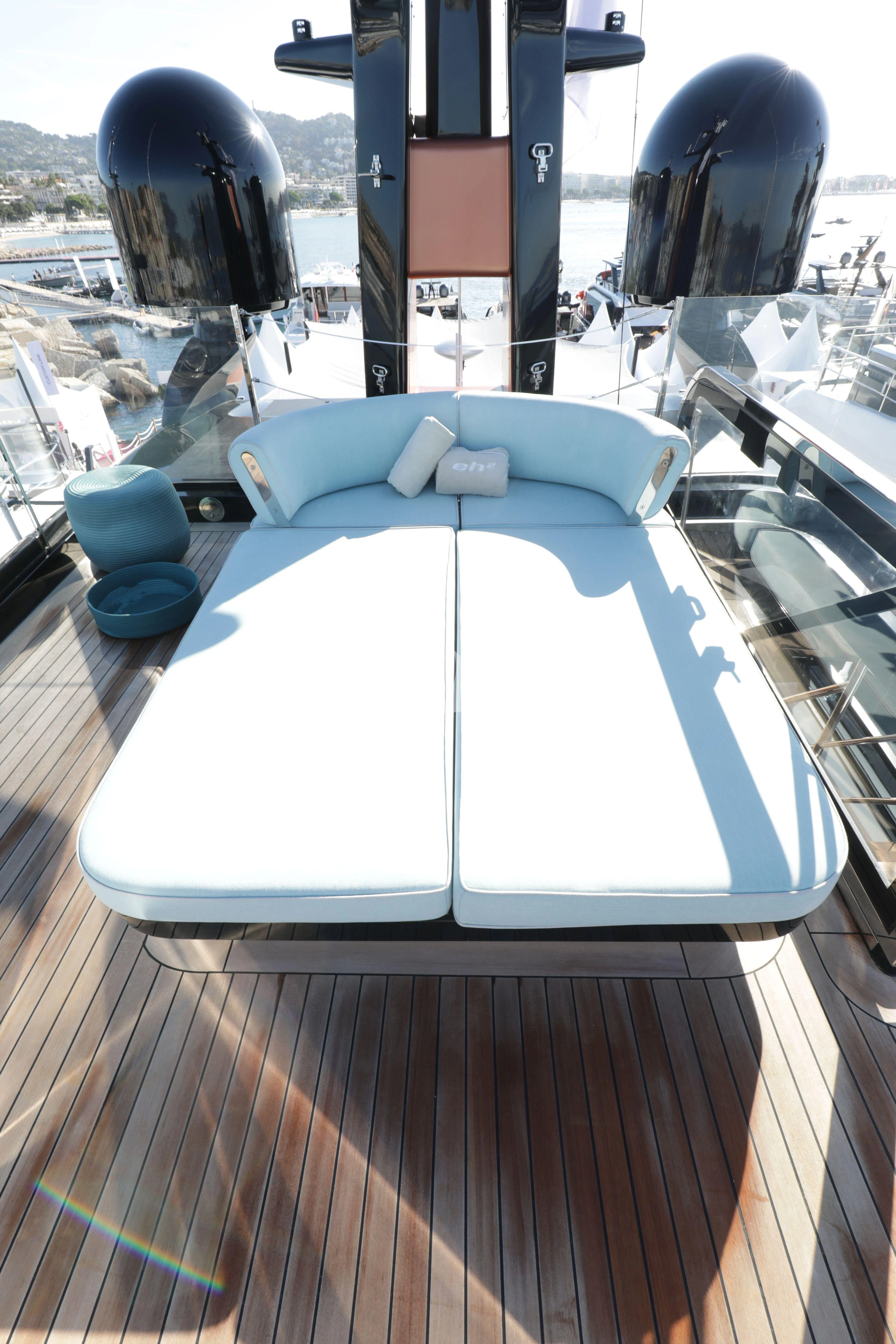 a large white pool with a slide aboard EH2 Yacht for Sale