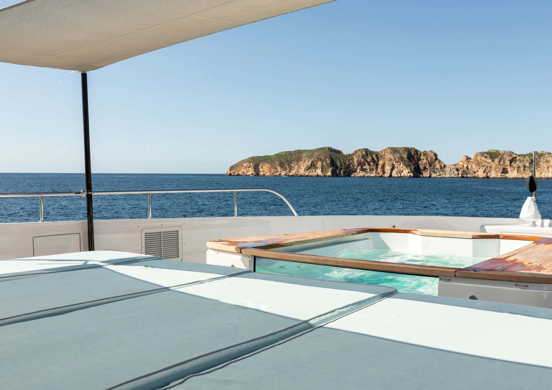 a pool on a deck overlooking the ocean aboard EH2 Yacht for Sale