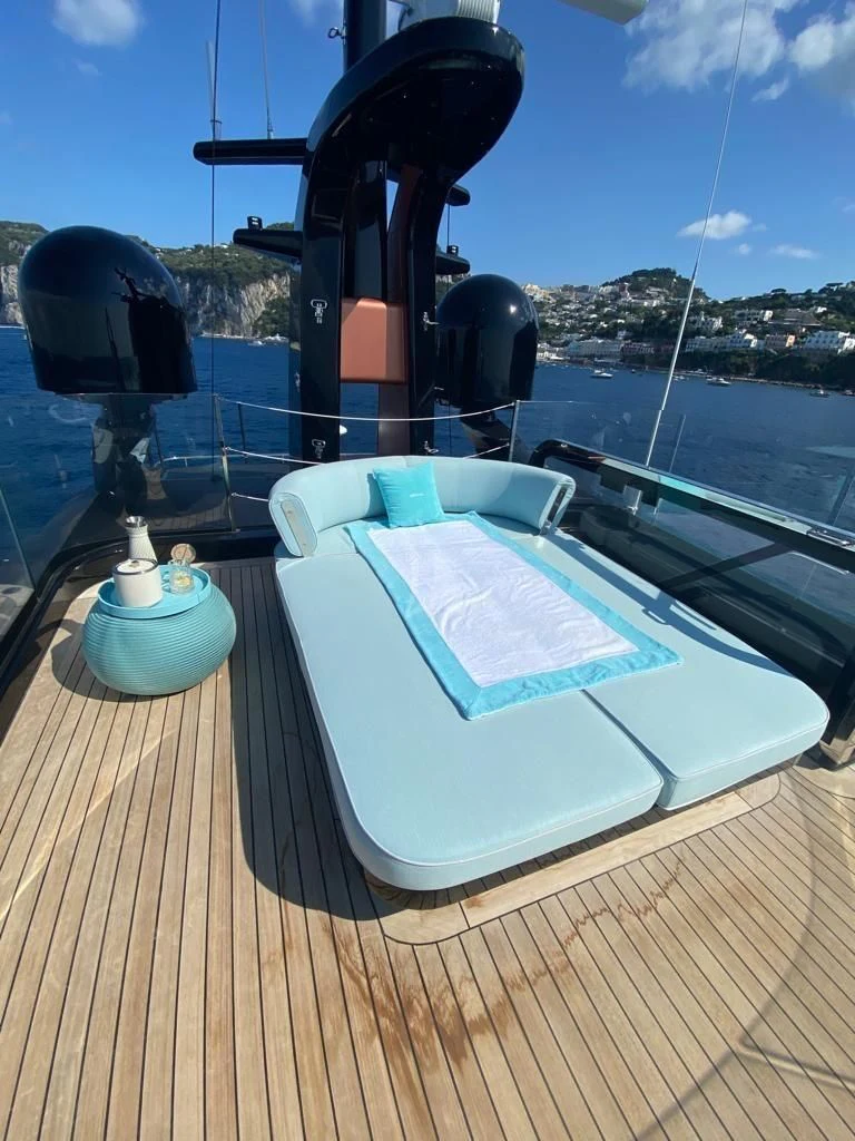 a book on a boat aboard EH2 Yacht for Sale