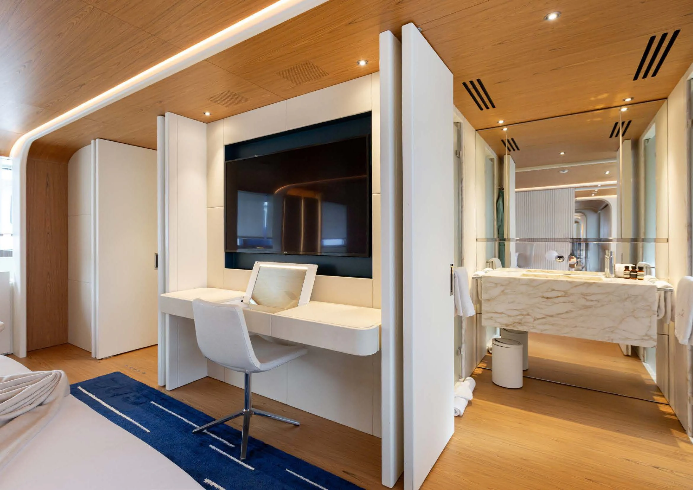 a room with a bed and a desk aboard EH2 Yacht for Sale