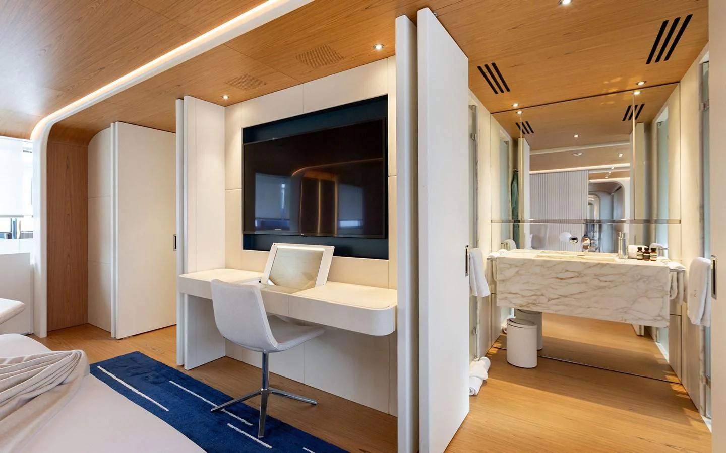 a room with a bed and a desk aboard EH2 Yacht for Sale