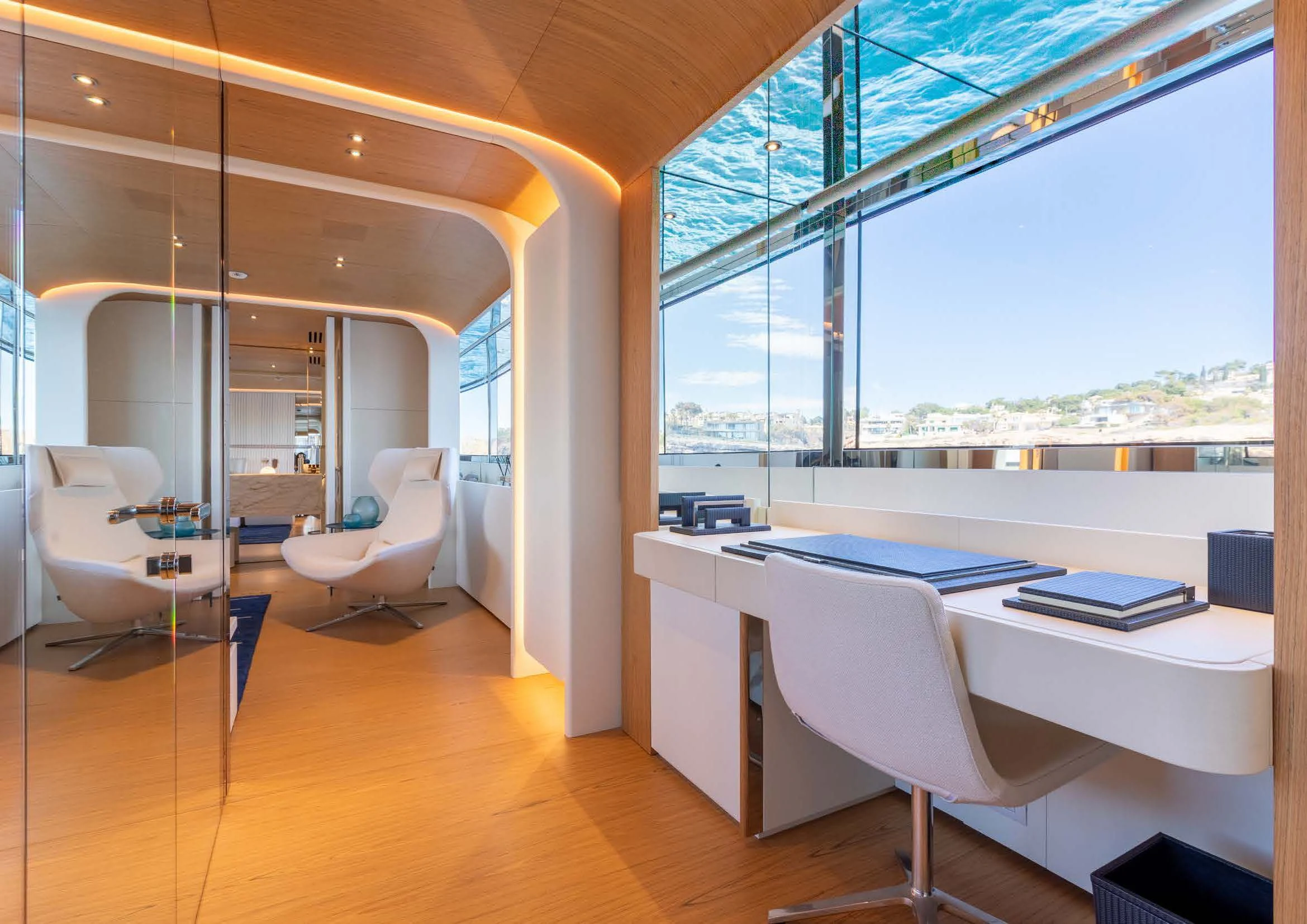 a room with a table chairs and a window aboard EH2 Yacht for Sale