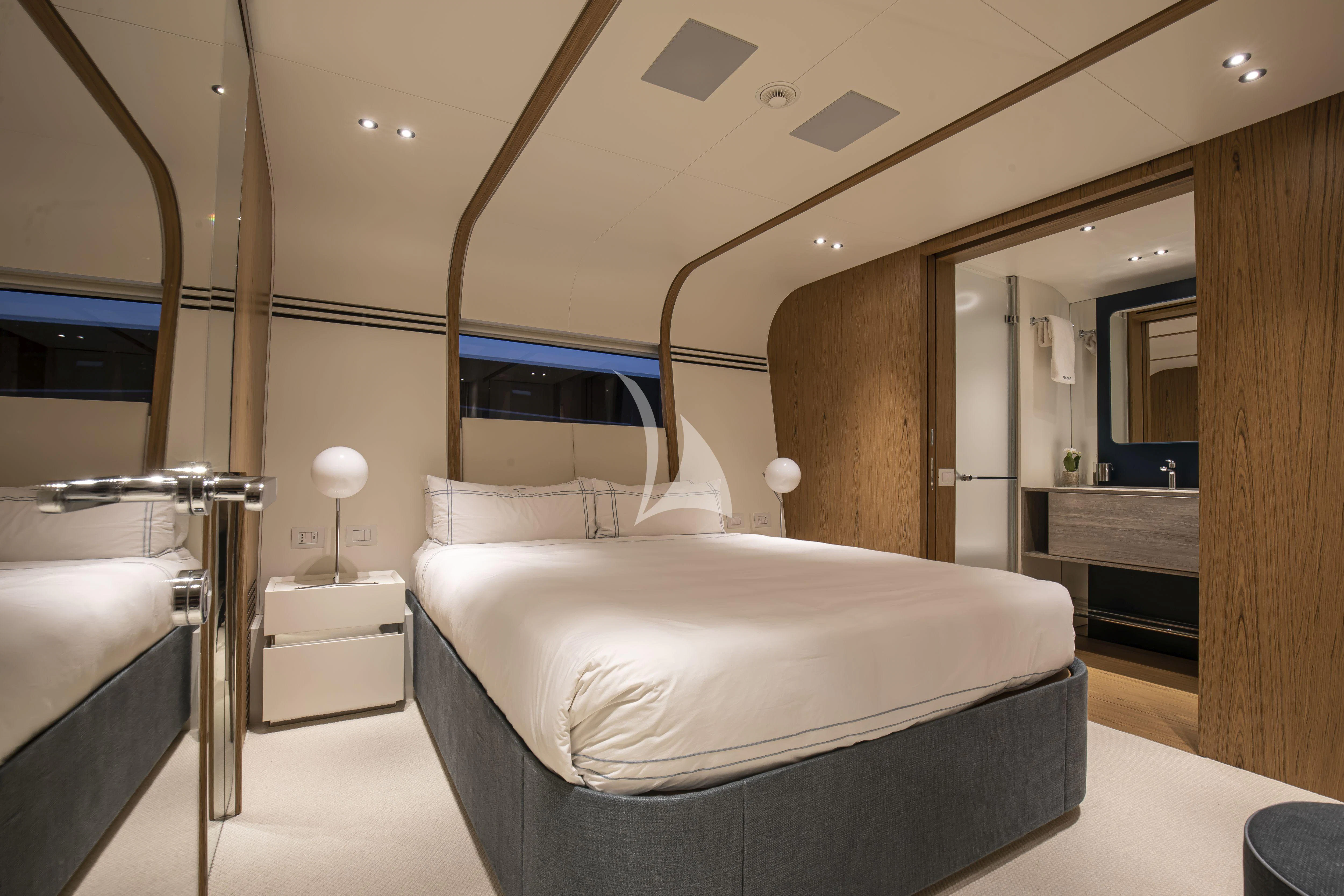 a room with a bed and a mirror aboard EH2 Yacht for Sale