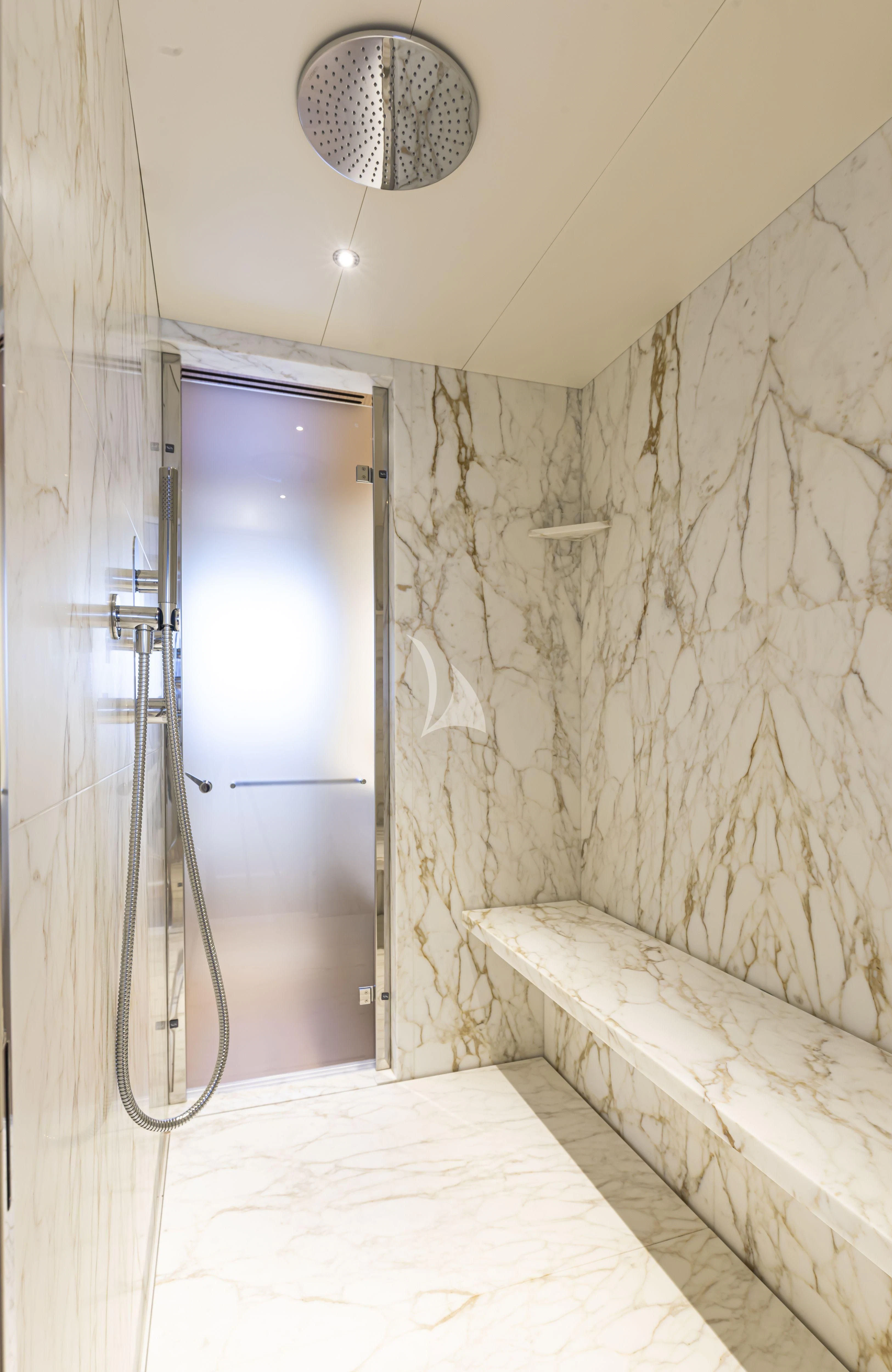 a bathroom with a tub and a mirror aboard EH2 Yacht for Sale