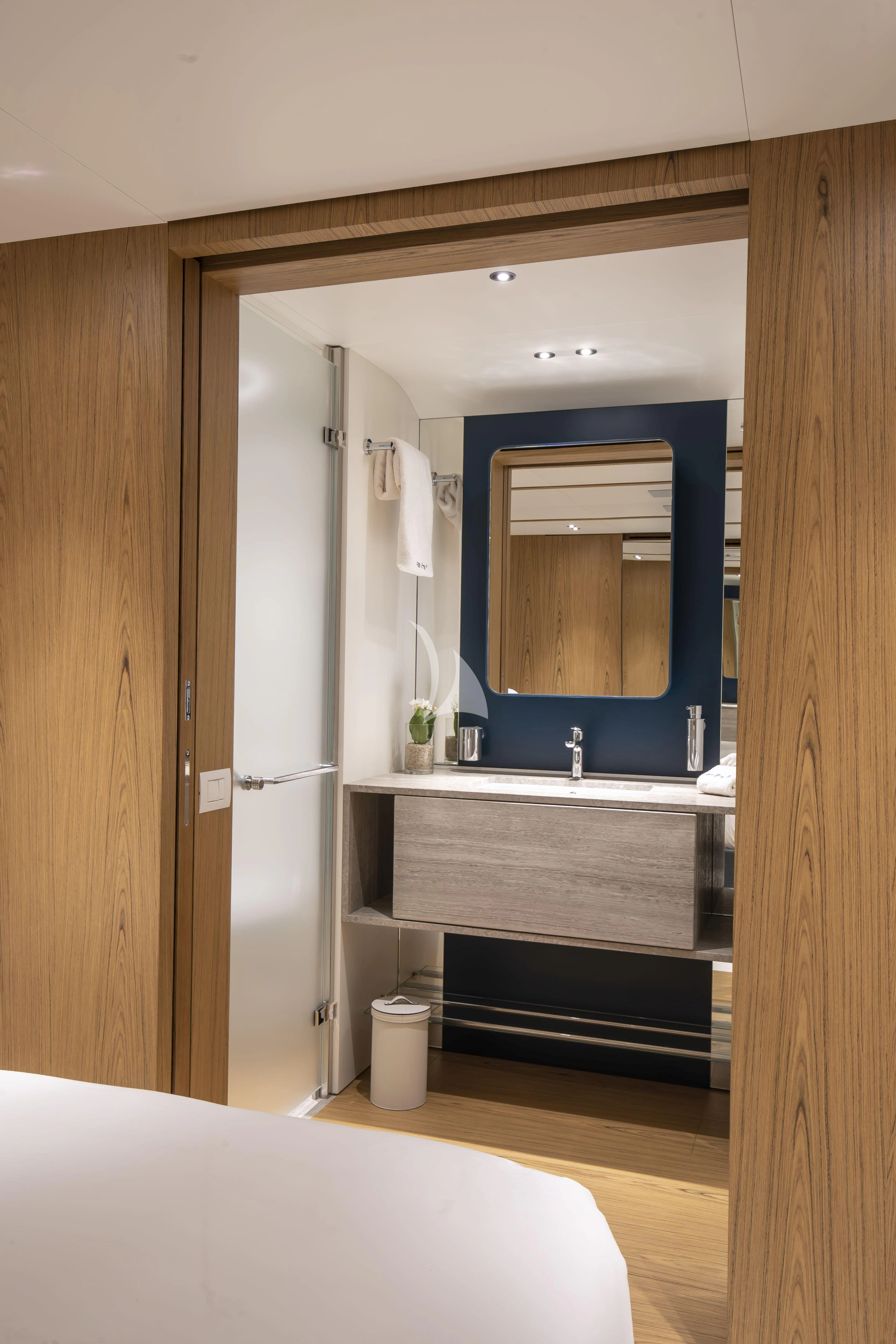 a bathroom with a large mirror aboard EH2 Yacht for Sale