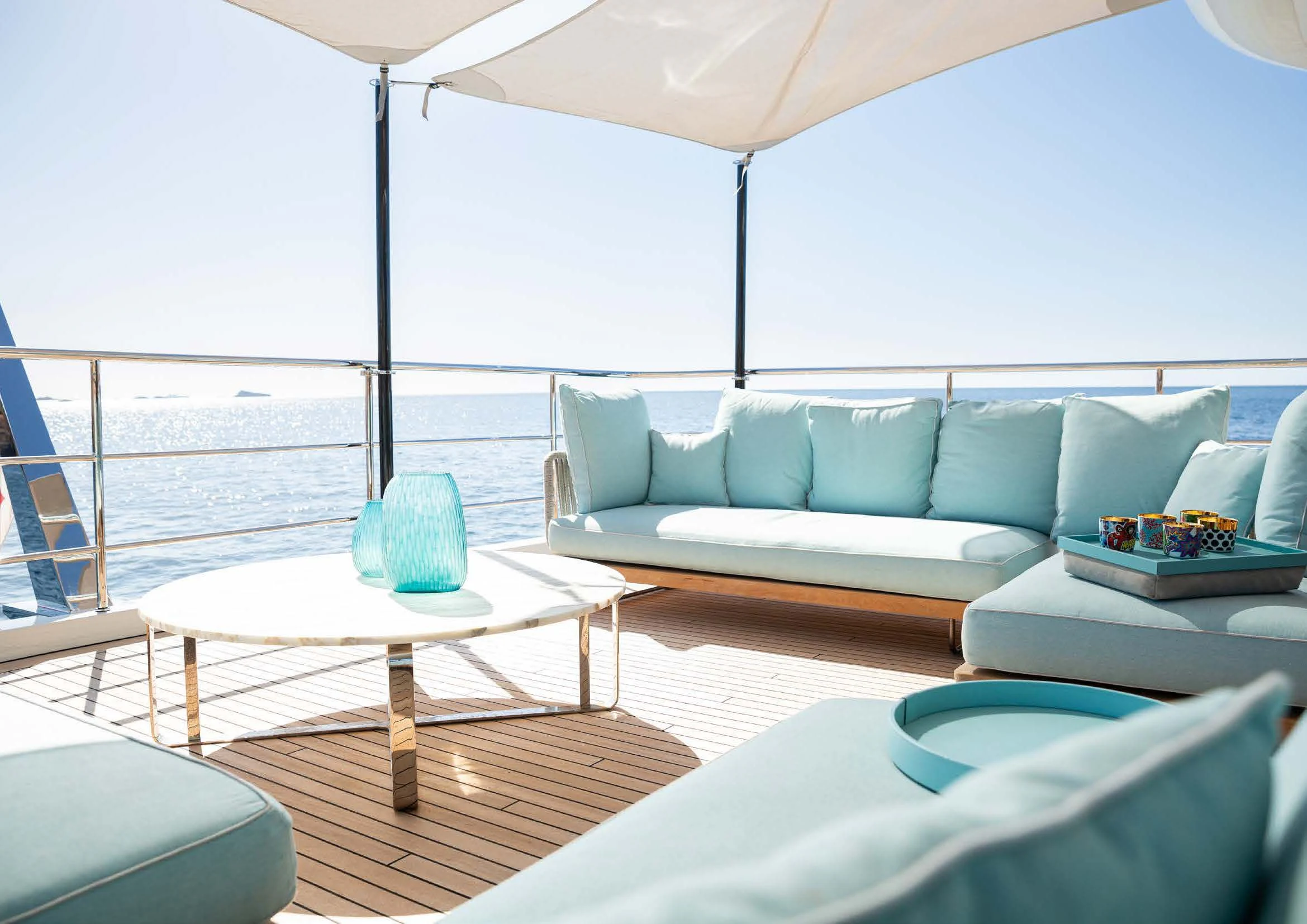 a living room with a couch and a table aboard EH2 Yacht for Sale