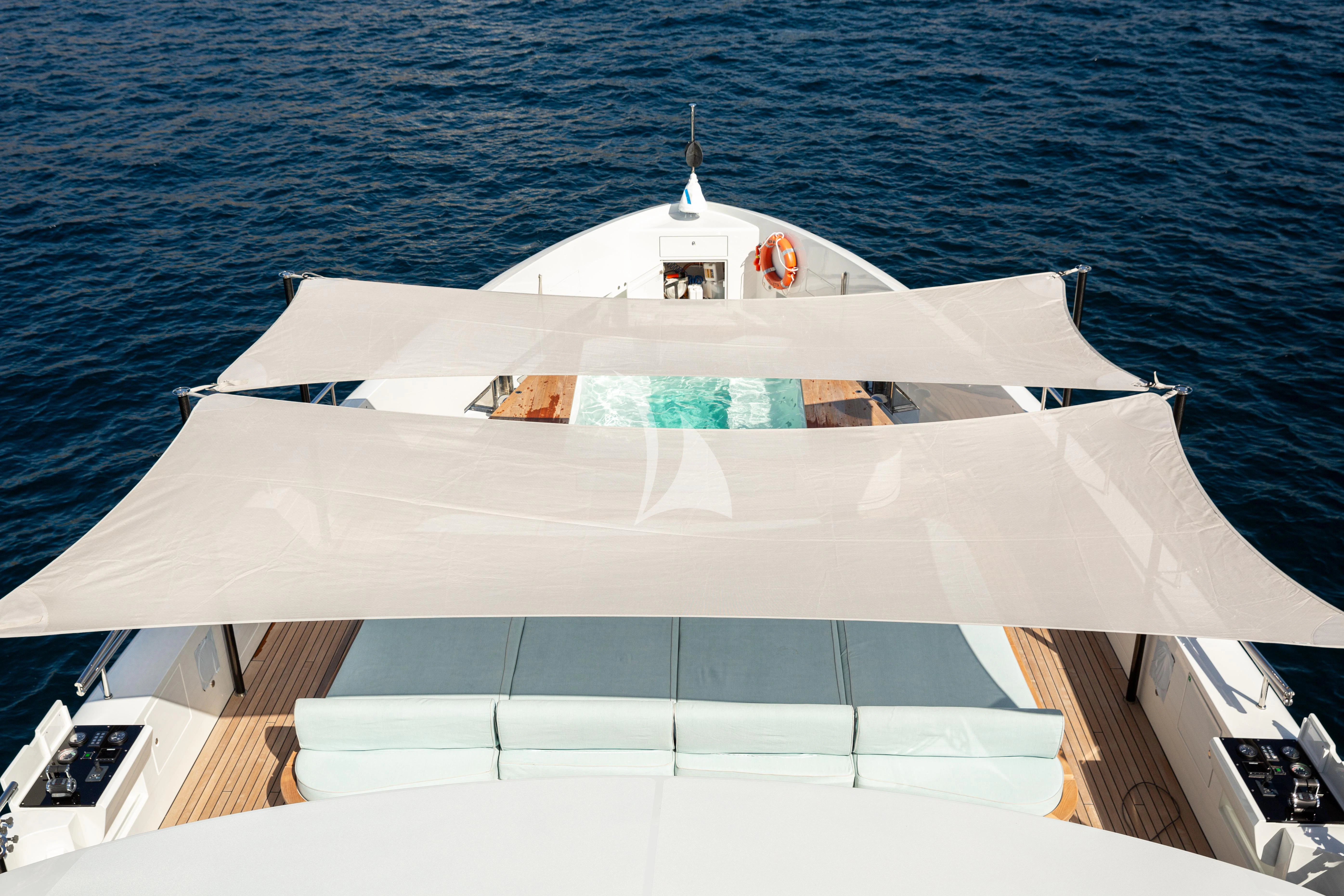 a white boat on the water aboard EH2 Yacht for Sale