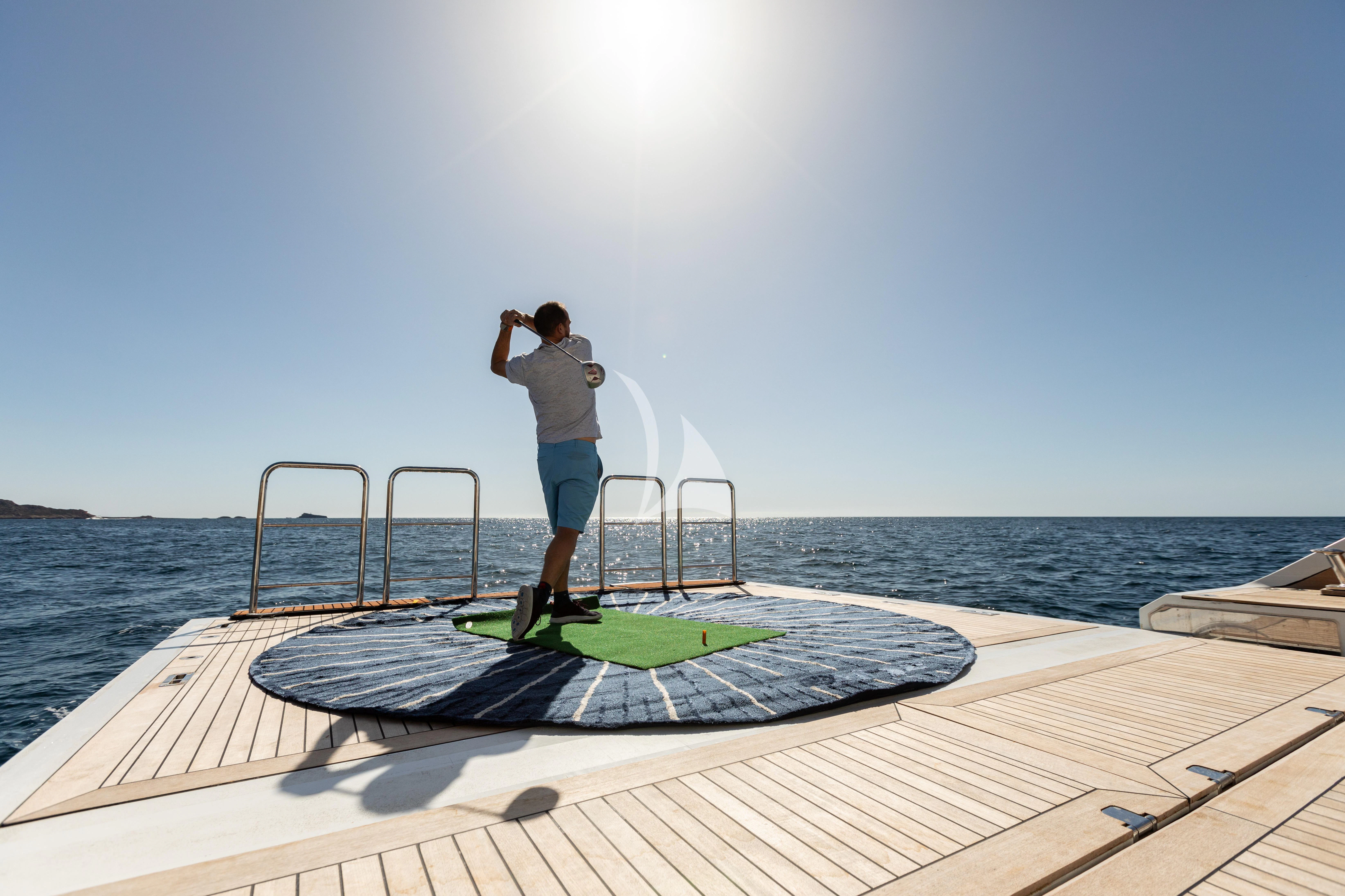 a man standing on a platform on a dock with a body of water in the background aboard EH2 Yacht for Sale