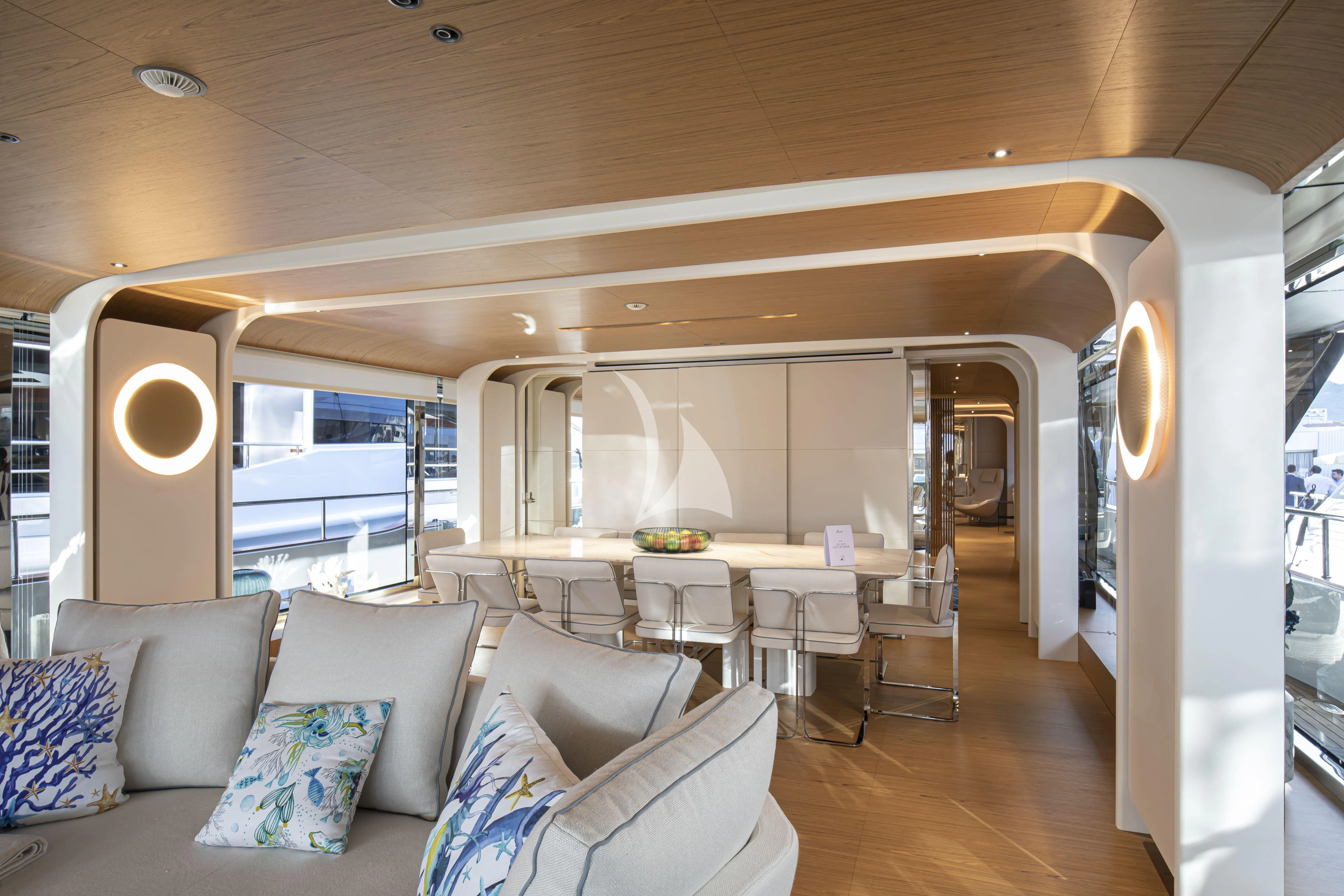 a living room with a couch and a table aboard EH2 Yacht for Sale