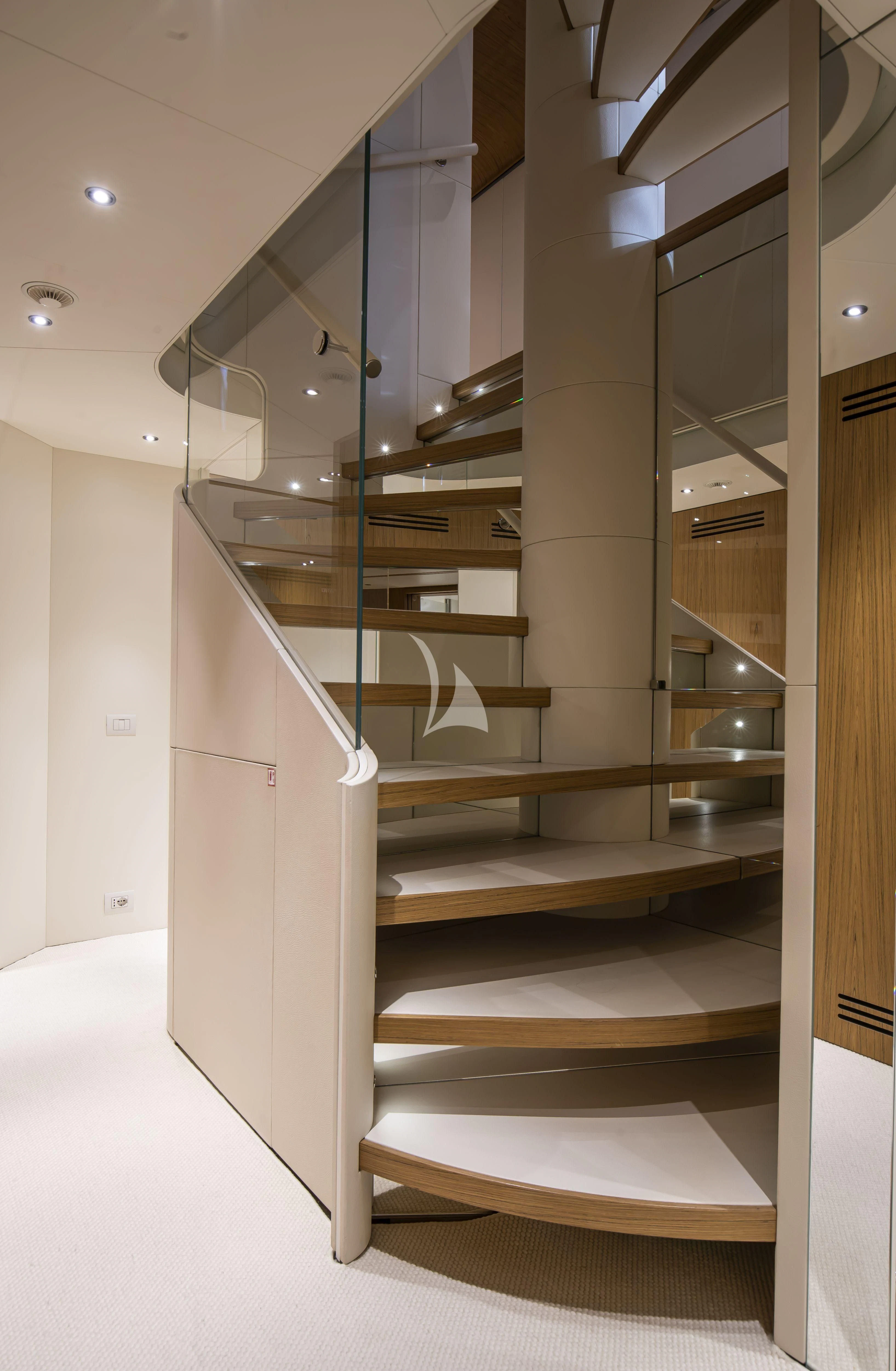 a staircase with a glass case aboard EH2 Yacht for Sale