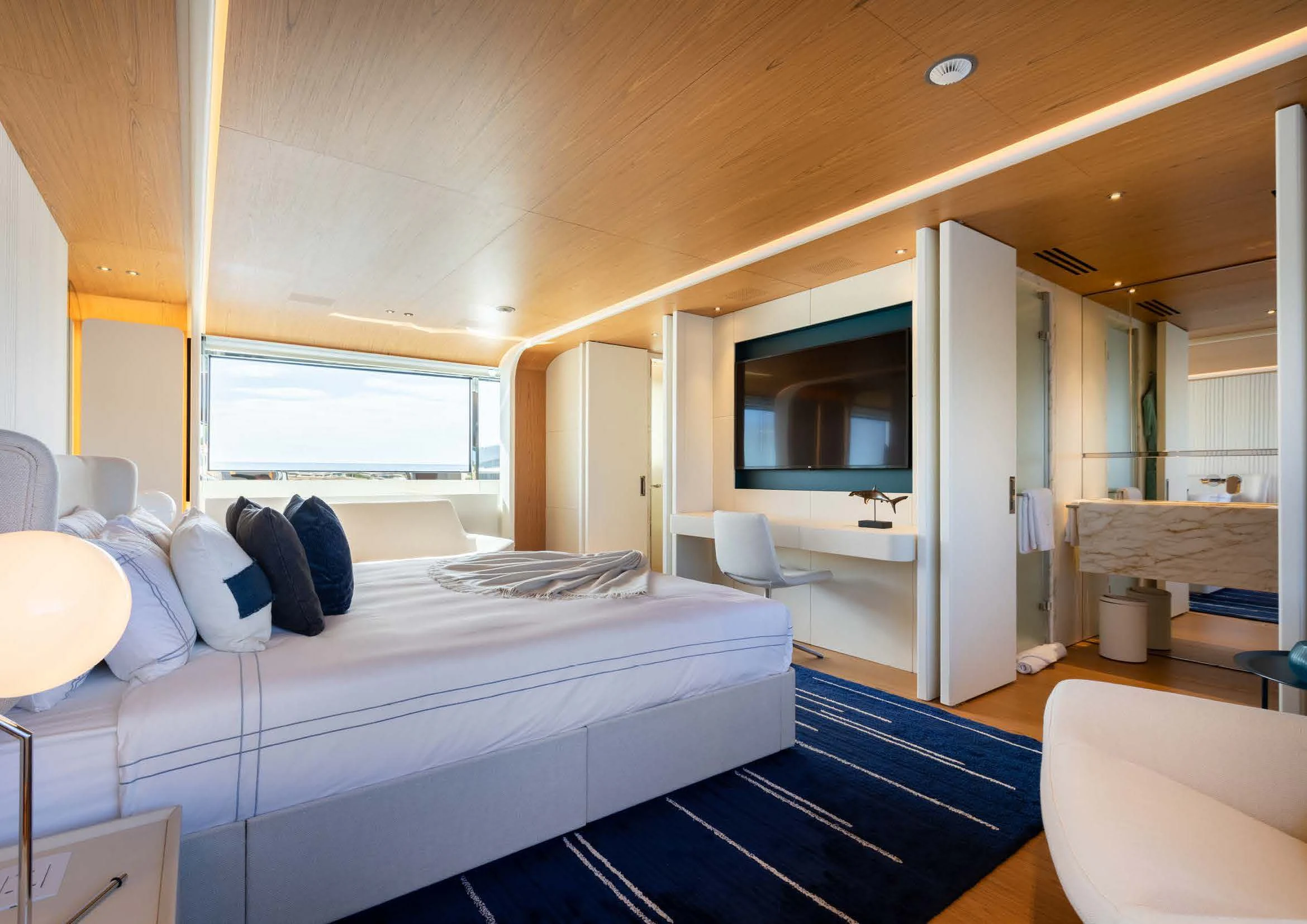 a room with a bed and a window aboard EH2 Yacht for Sale