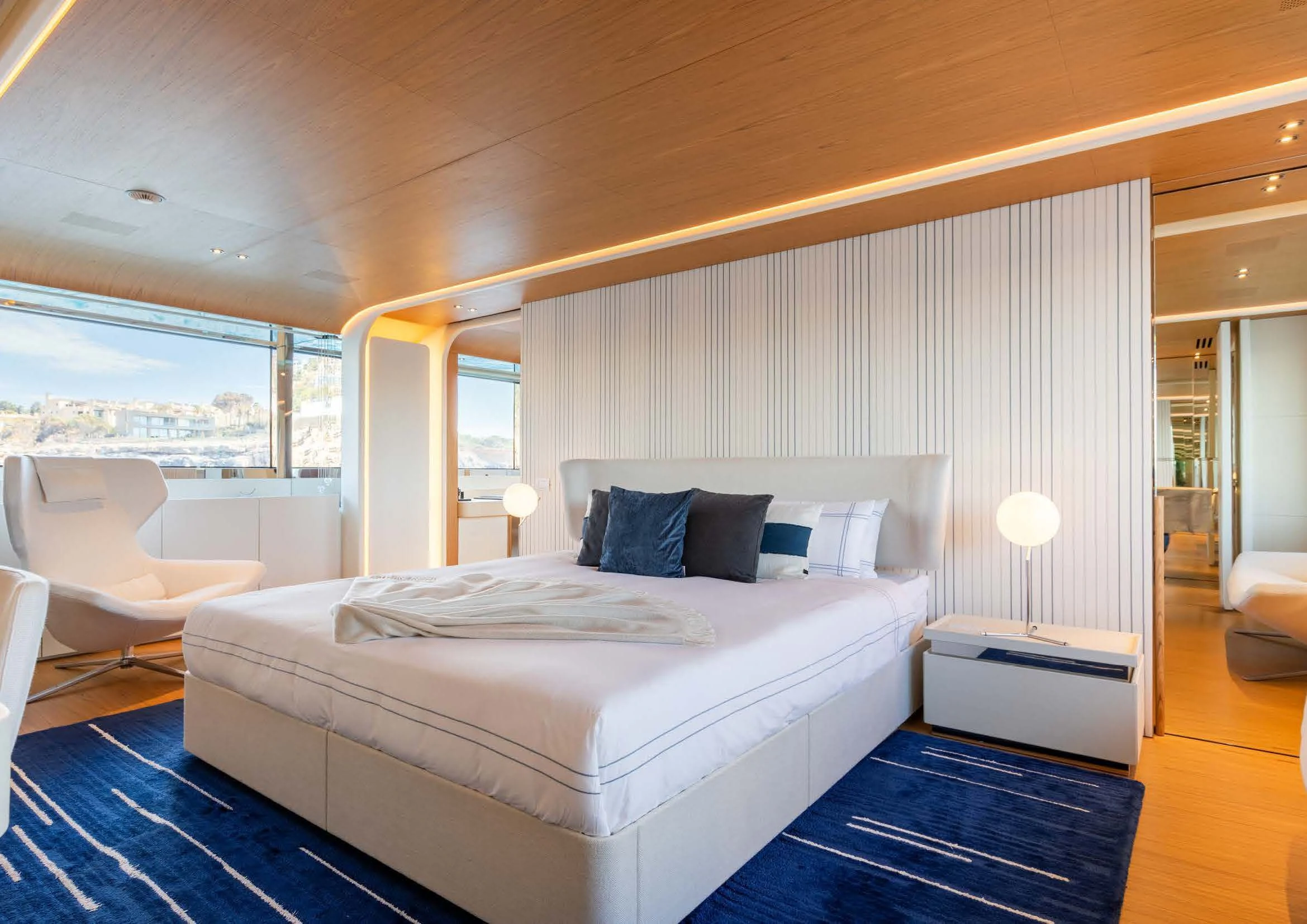 a large bedroom with a large bed aboard EH2 Yacht for Sale