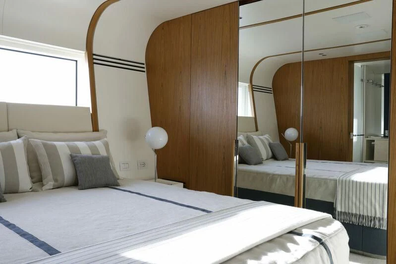 a room with two beds aboard EH2 Yacht for Sale