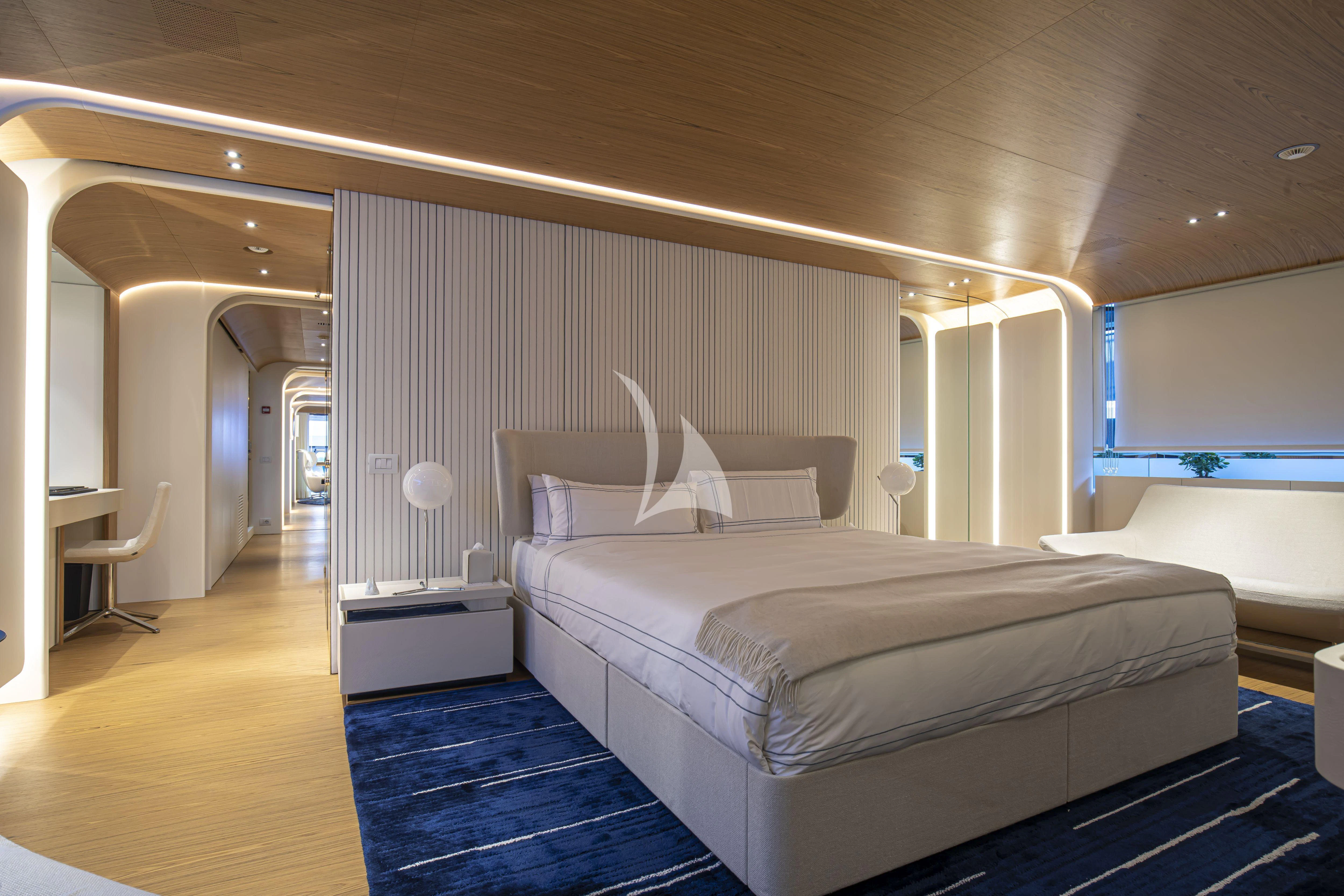 a room with a bed and a desk aboard EH2 Yacht for Sale