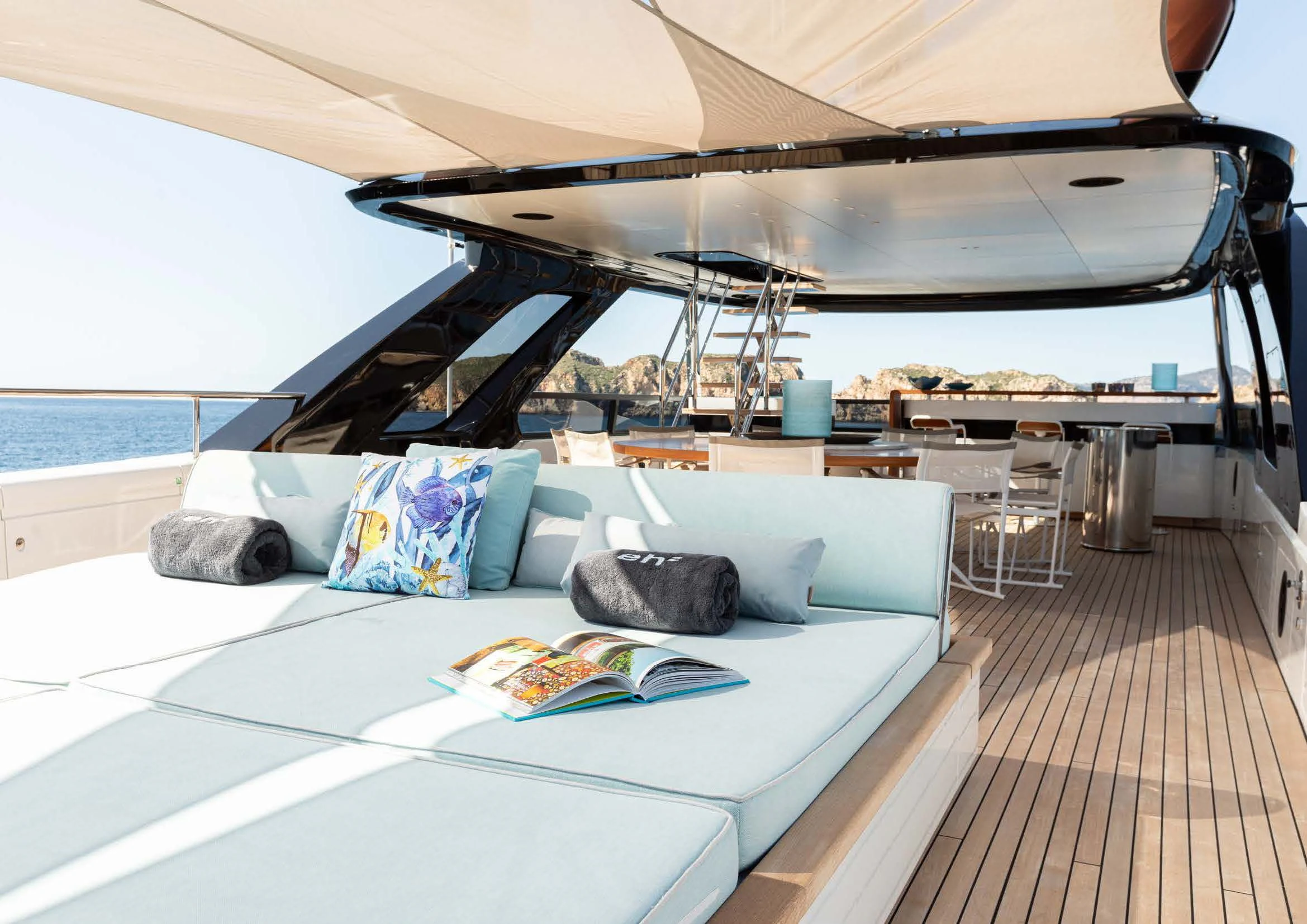 a large white bed with a white canopy over it aboard EH2 Yacht for Sale