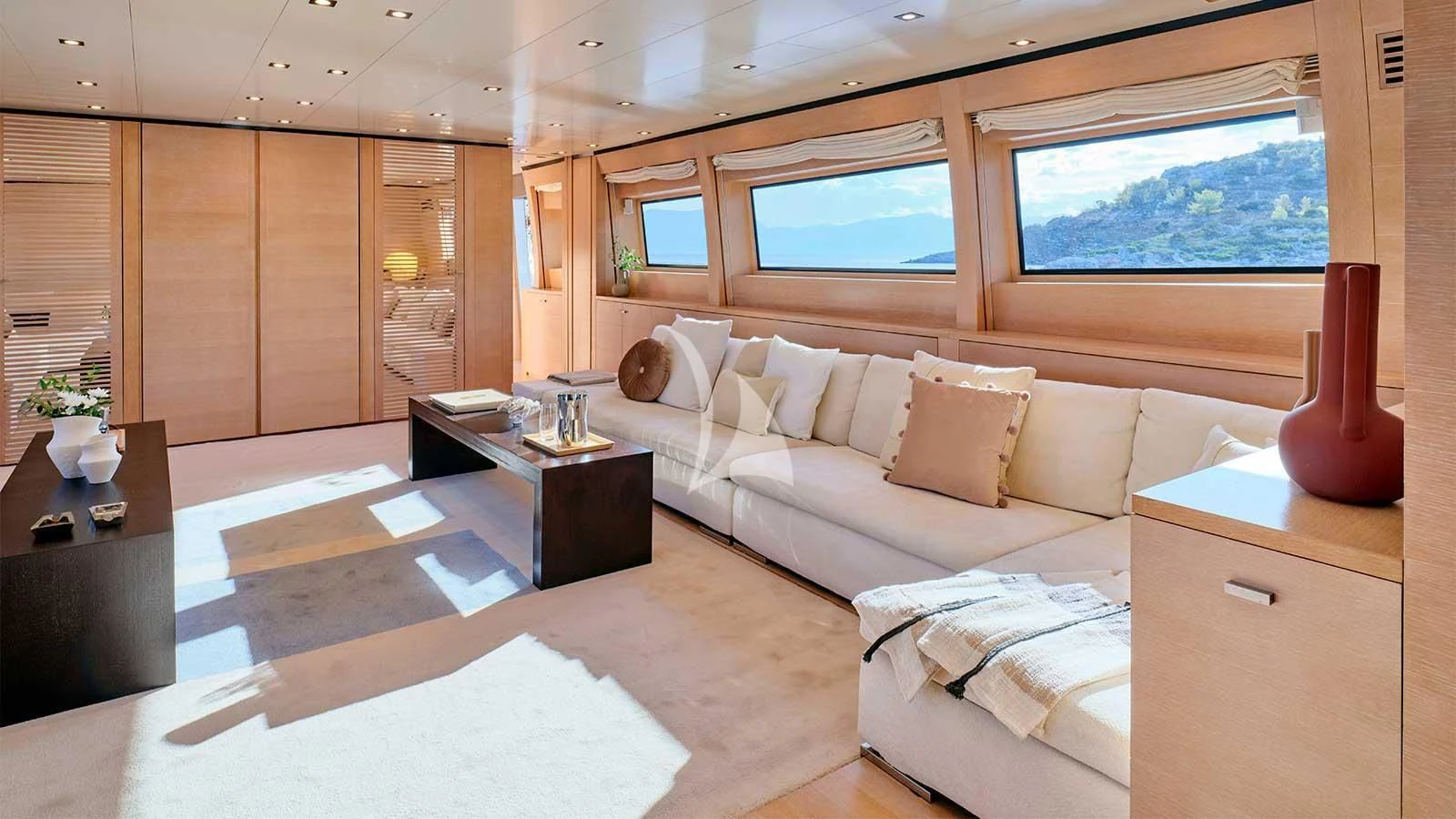 a room with a couch and a table aboard AMICI PER SEMPRE Yacht for Charter