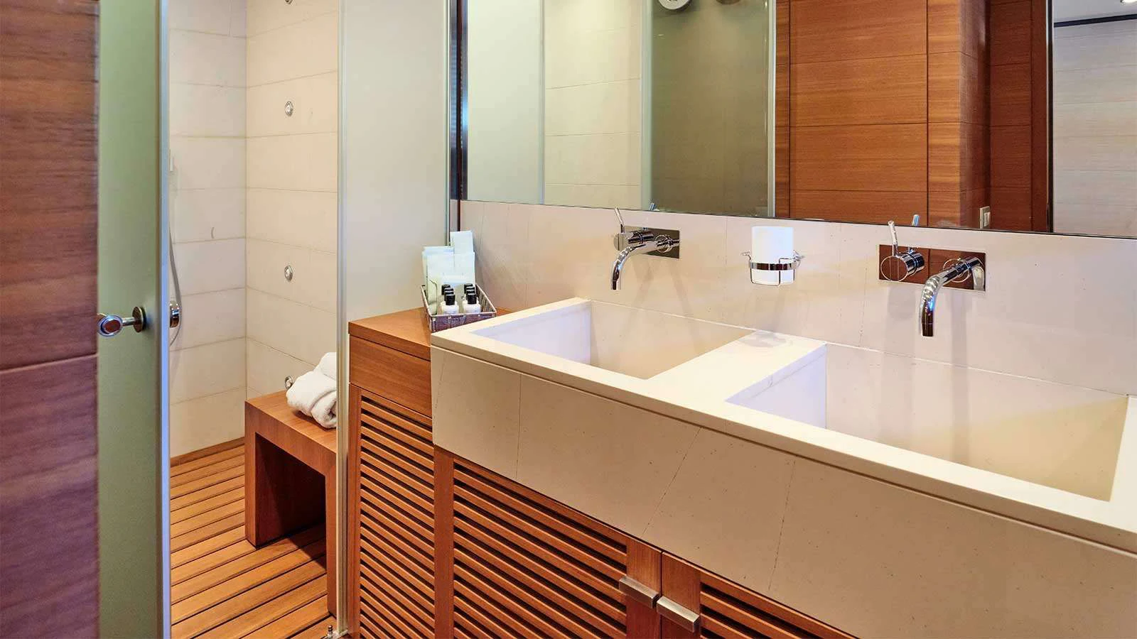 a bathroom with a sink and a mirror aboard AMICI PER SEMPRE Yacht for Charter