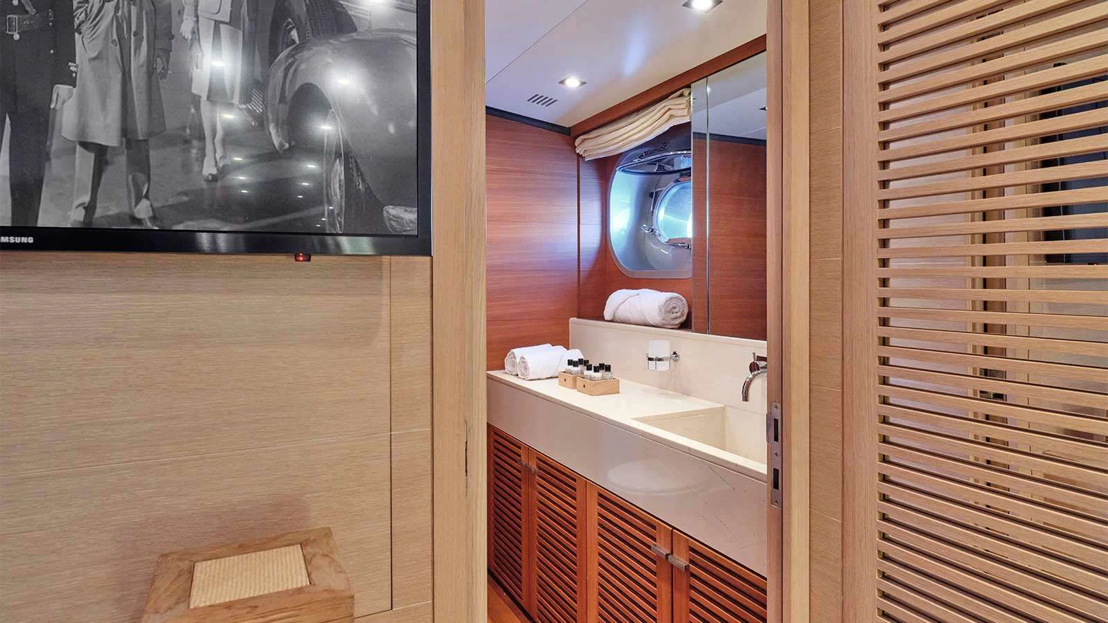 a bathroom with a large mirror aboard AMICI PER SEMPRE Yacht for Charter