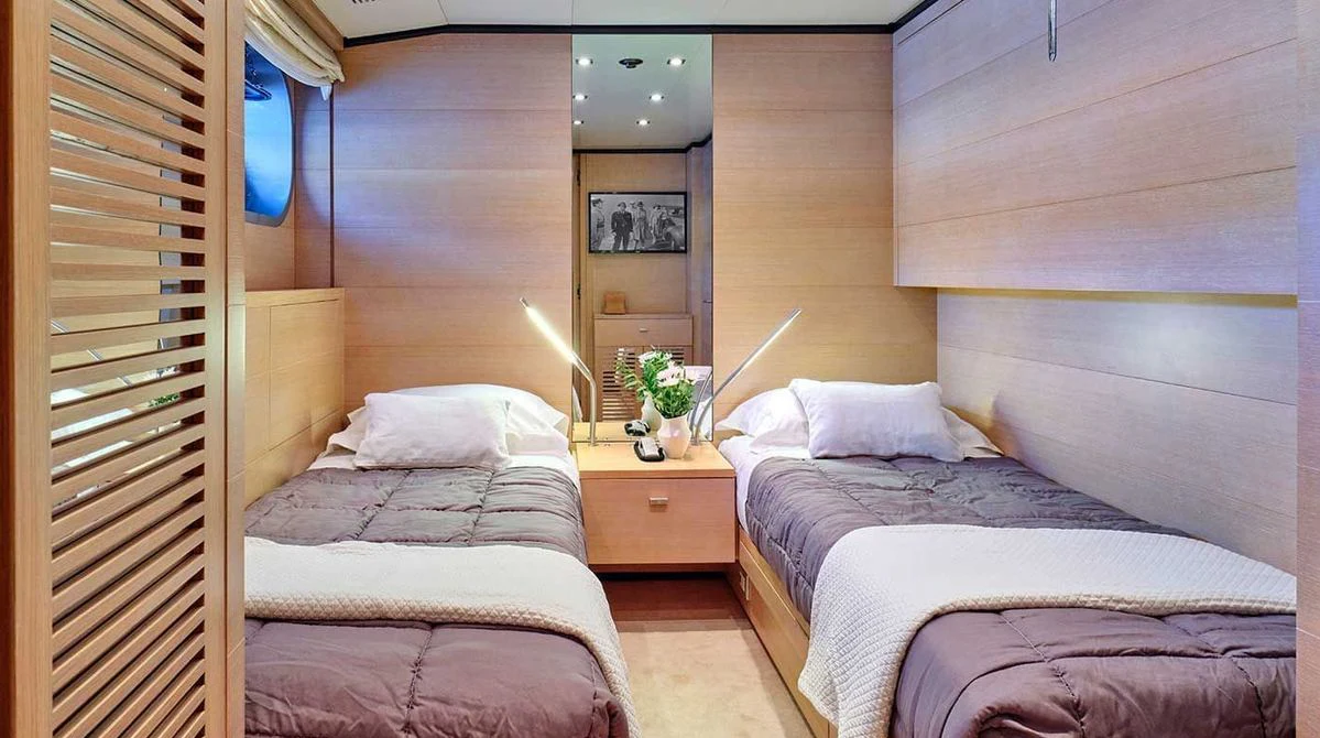a room with two beds aboard AMICI PER SEMPRE Yacht for Charter