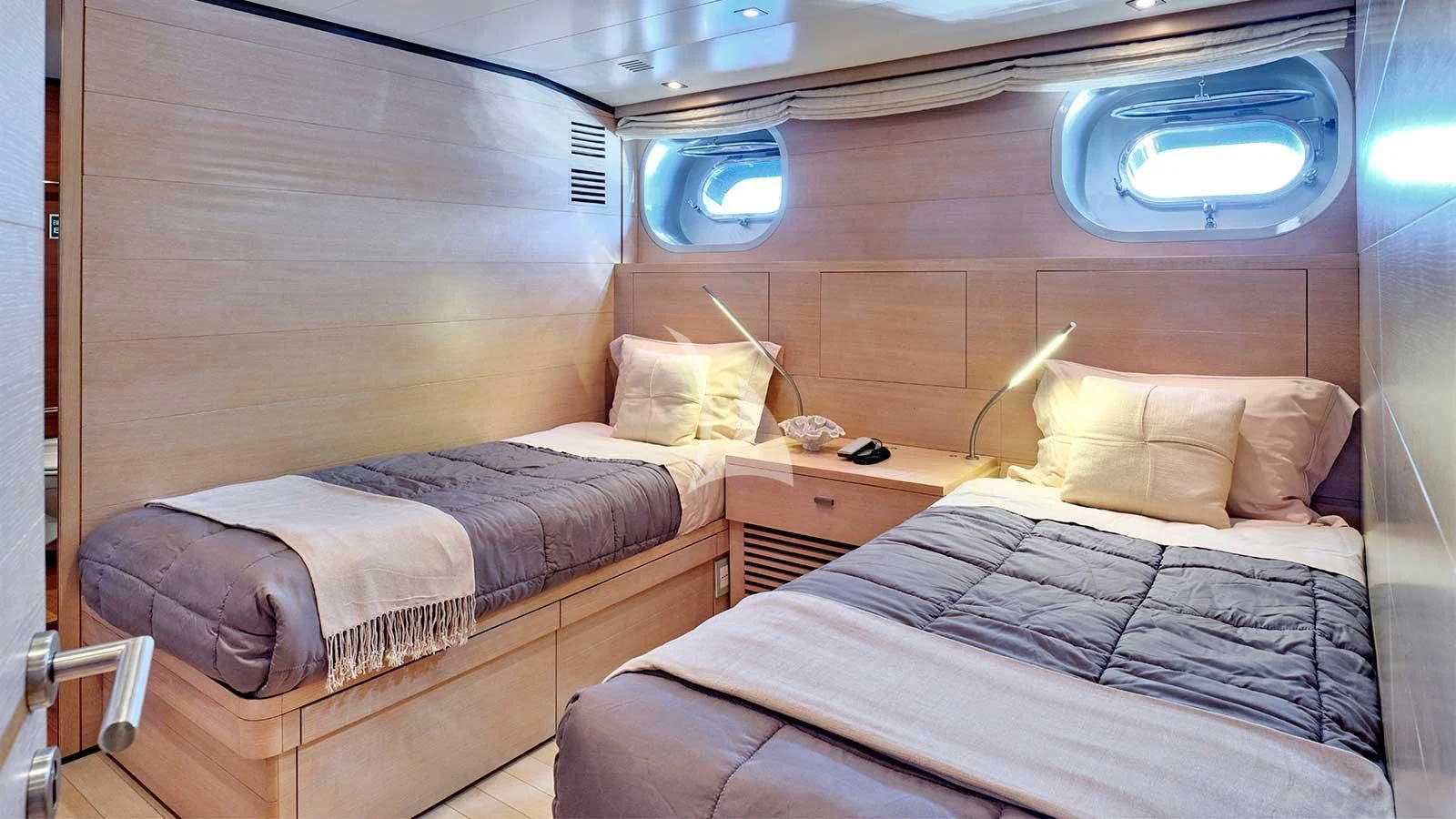 a couple of beds in a room aboard AMICI PER SEMPRE Yacht for Charter