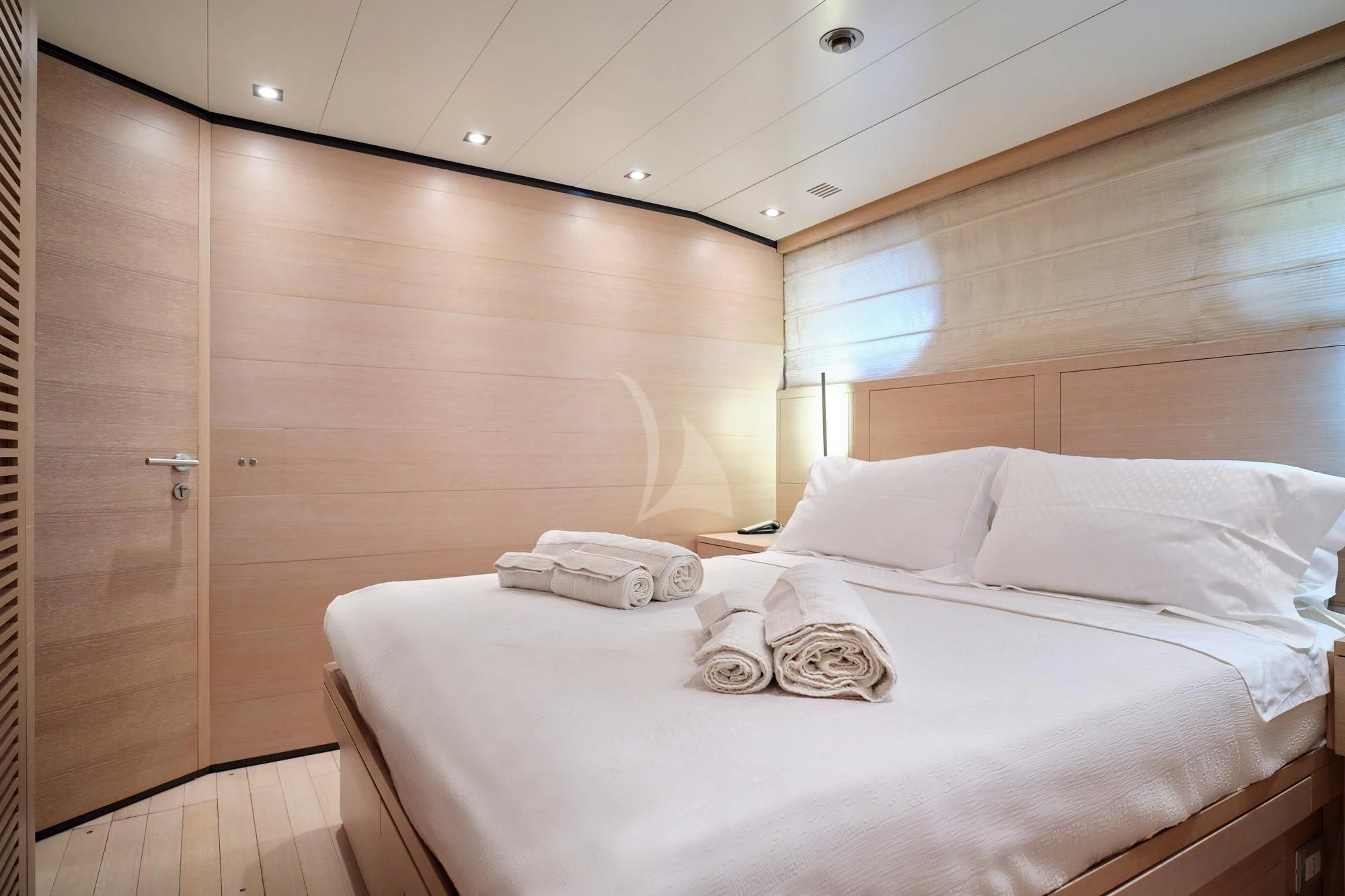 a bed with white sheets aboard AMICI PER SEMPRE Yacht for Charter