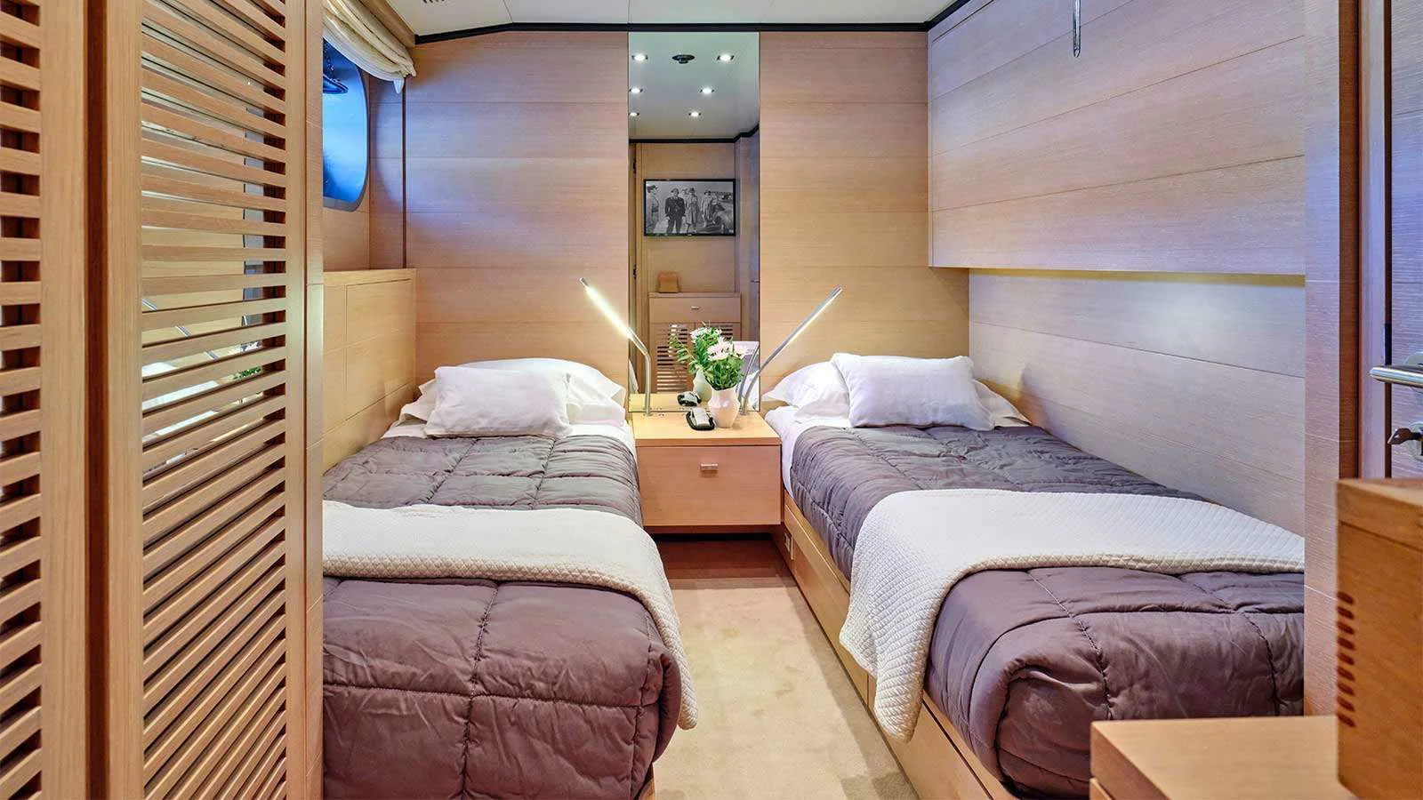a room with two beds aboard AMICI PER SEMPRE Yacht for Charter