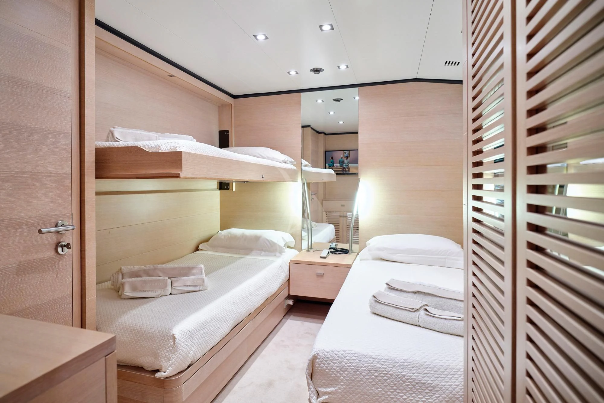 a room with two beds aboard AMICI PER SEMPRE Yacht for Charter