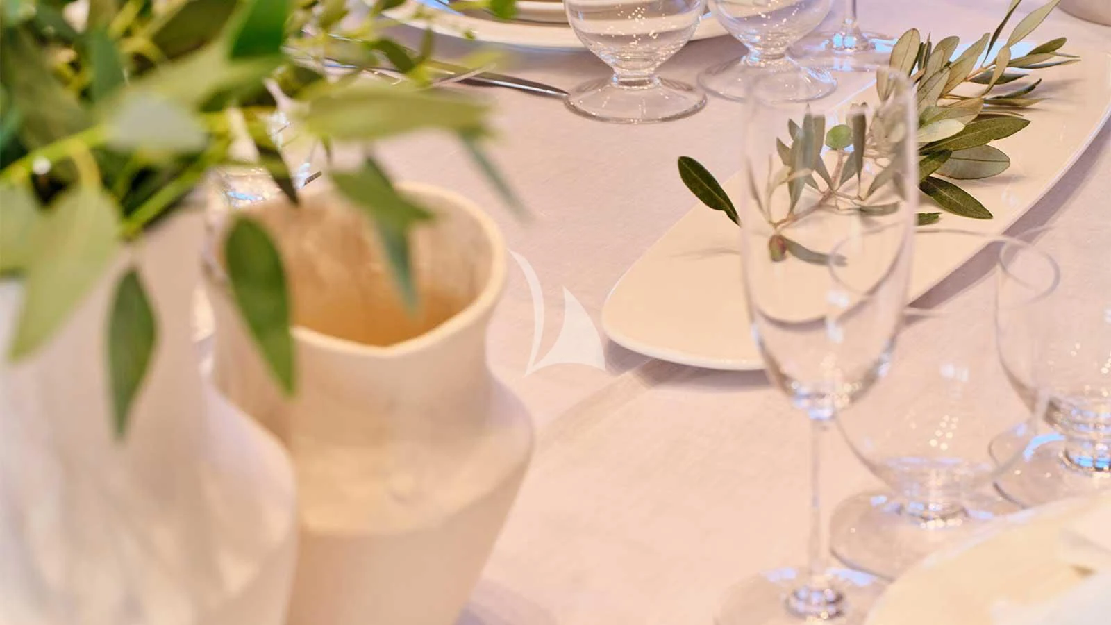 a group of glasses on a table aboard AMICI PER SEMPRE Yacht for Charter