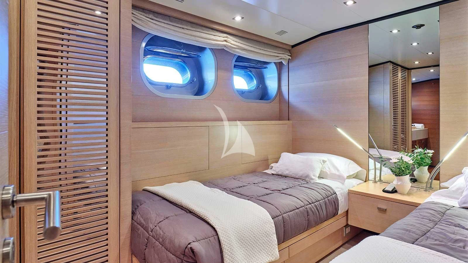 a room with a bed and a window aboard AMICI PER SEMPRE Yacht for Charter