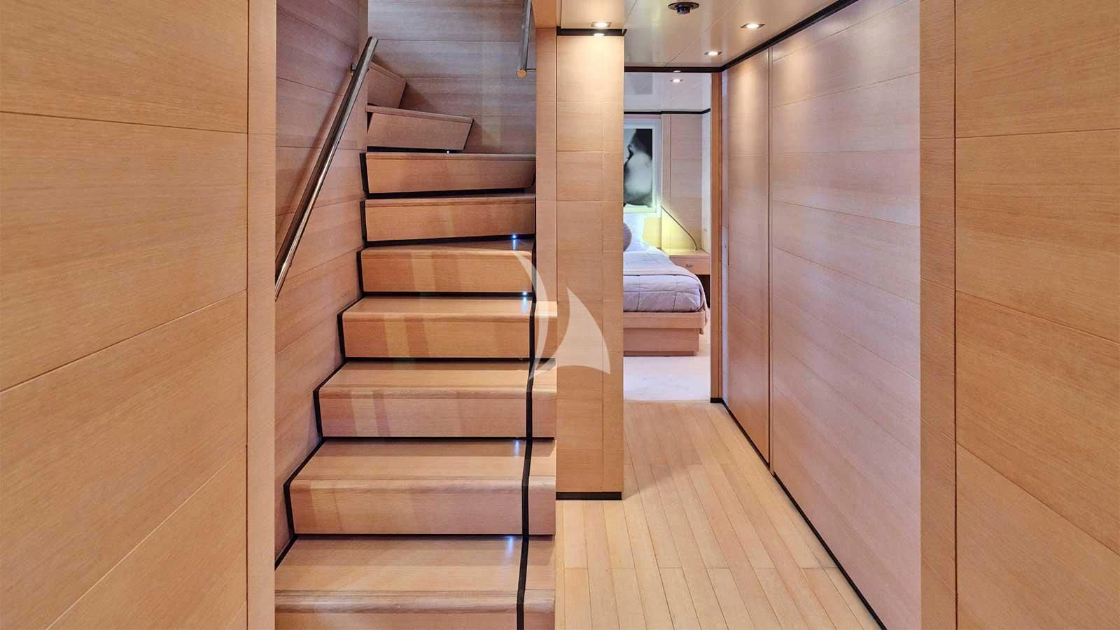 a wooden staircase in a room aboard AMICI PER SEMPRE Yacht for Charter