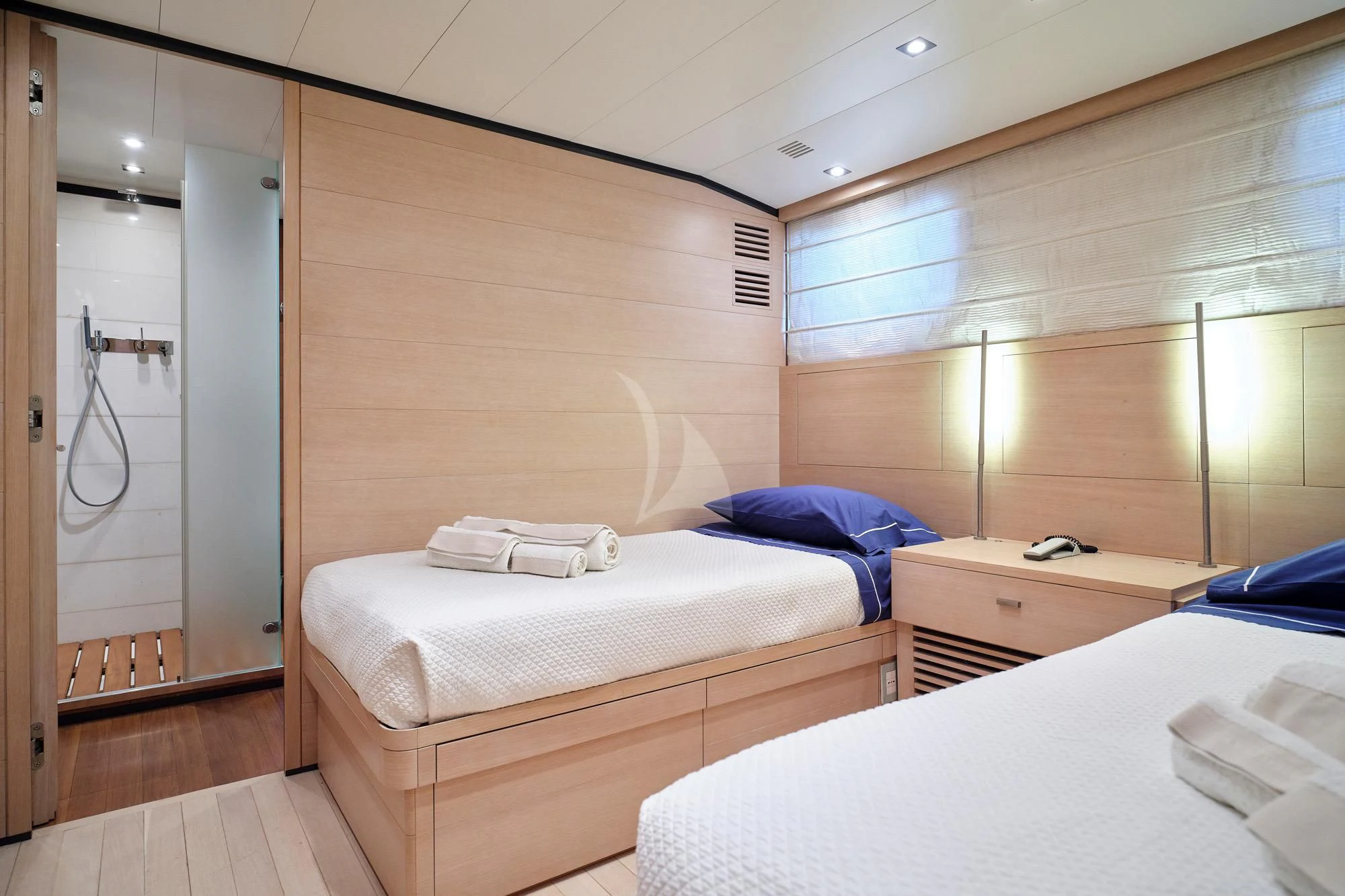a room with two beds aboard AMICI PER SEMPRE Yacht for Charter