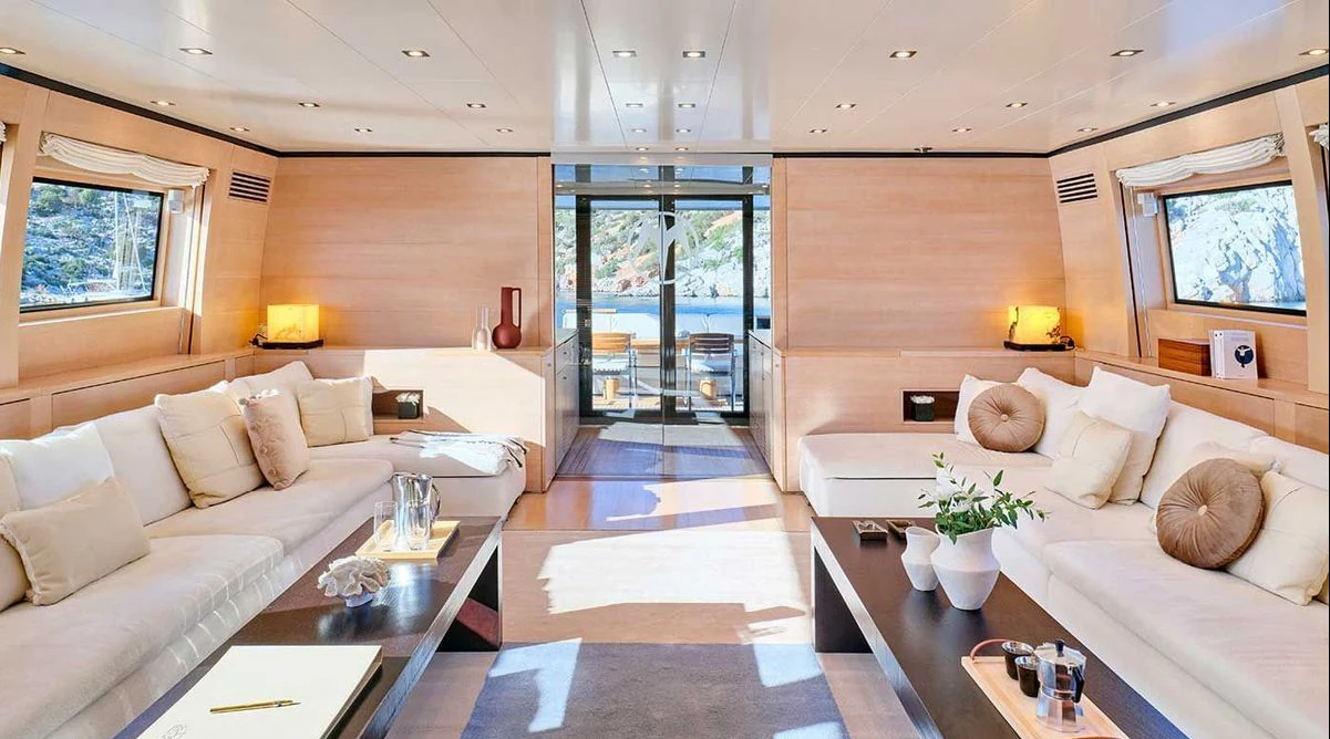 a living room with a large window aboard AMICI PER SEMPRE Yacht for Charter
