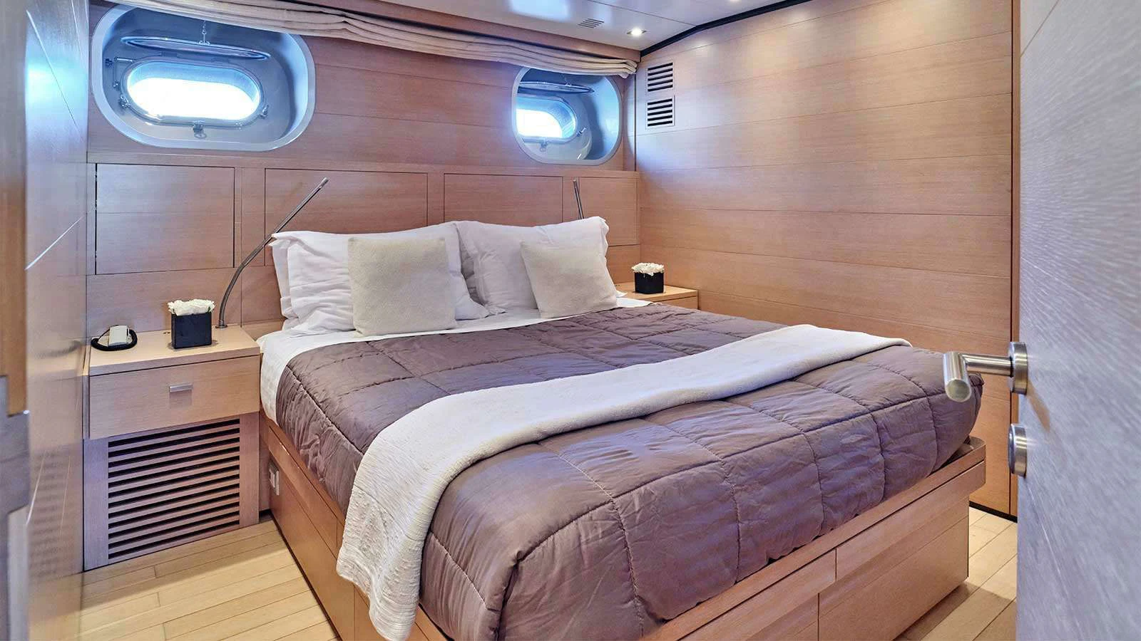 a bed in a room aboard AMICI PER SEMPRE Yacht for Charter