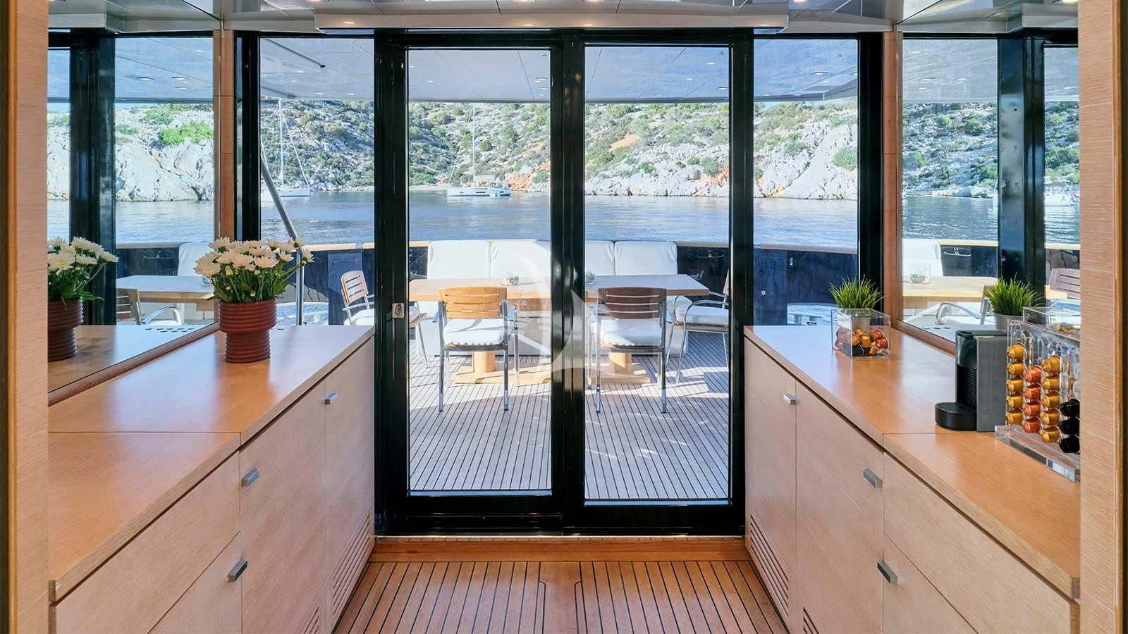 a room with a view of the backyard and patio aboard AMICI PER SEMPRE Yacht for Charter