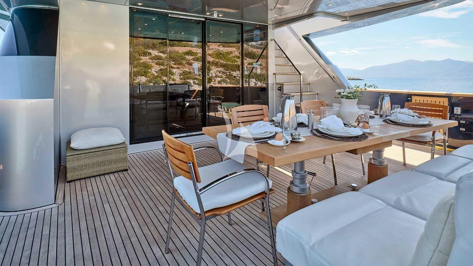 a room with a table and chairs aboard AMICI PER SEMPRE Yacht for Charter